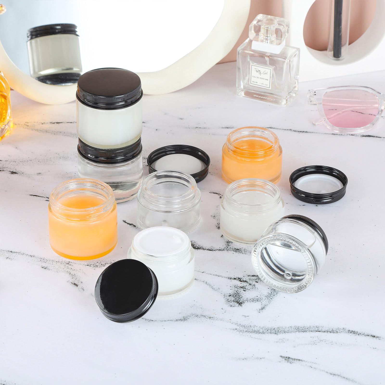 24 Pack 2oz Clear Glass Jars with Black Metal Lids - Small Empty Cosmetic Containers with Inner Liners - Travel-Sized Lotion Jars with Labels - Perfect for DIY Beauty Products, Travel Toiletries & Home Organization