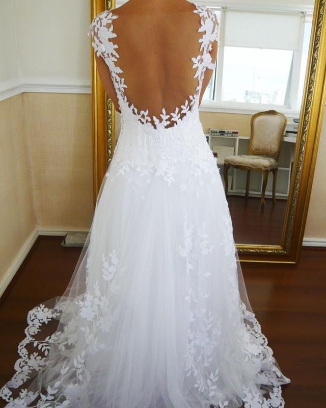 Elegant A-Line Cap Sleeve Nude Back Tulle Wedding Dress with Lace Appliques - Perfect for Bridal Gowns, Formal Events & Romantic Ceremonies