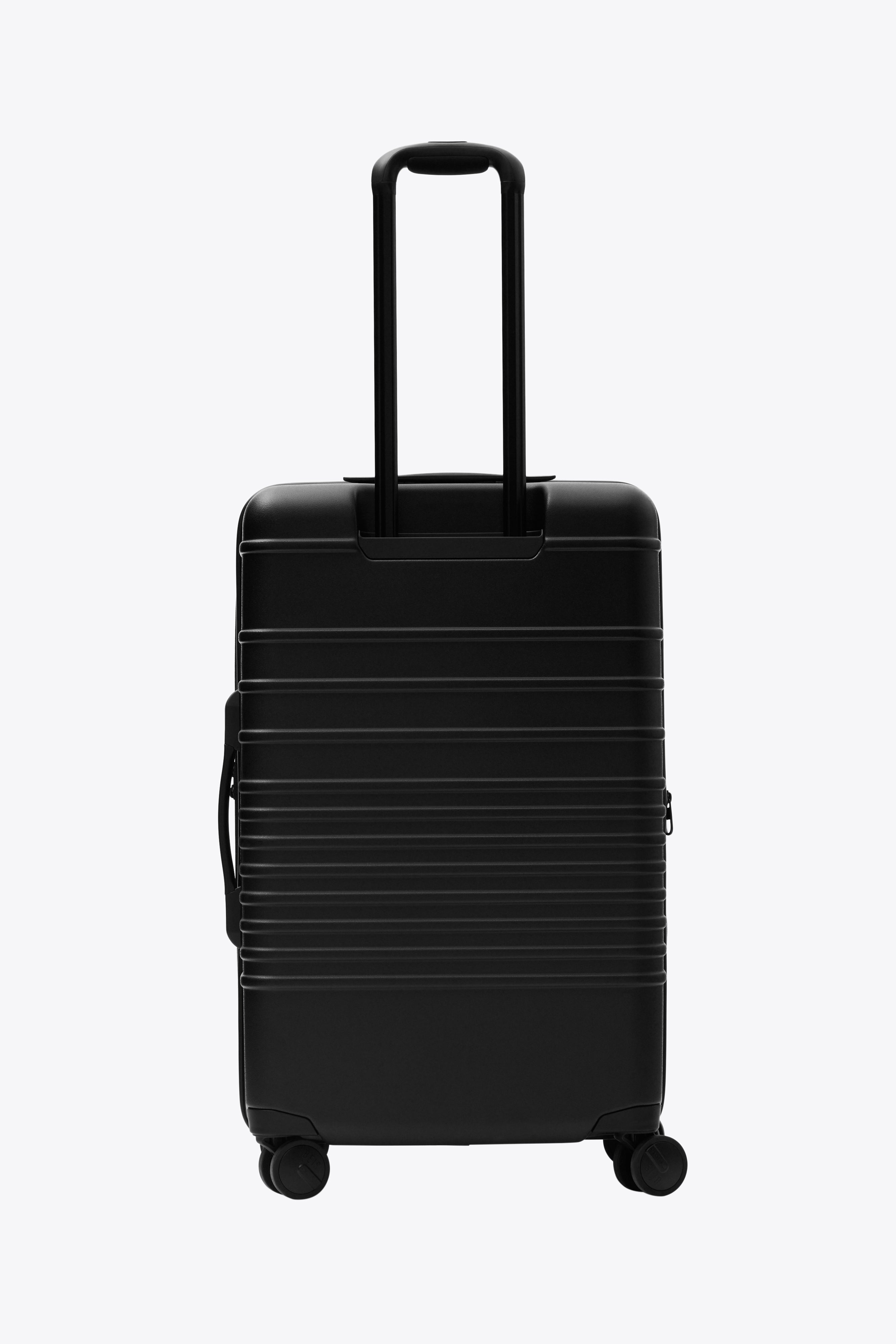 All Black Medium Check-In Roller Luggage - Perfect for Business Travel & Weekend Getaways