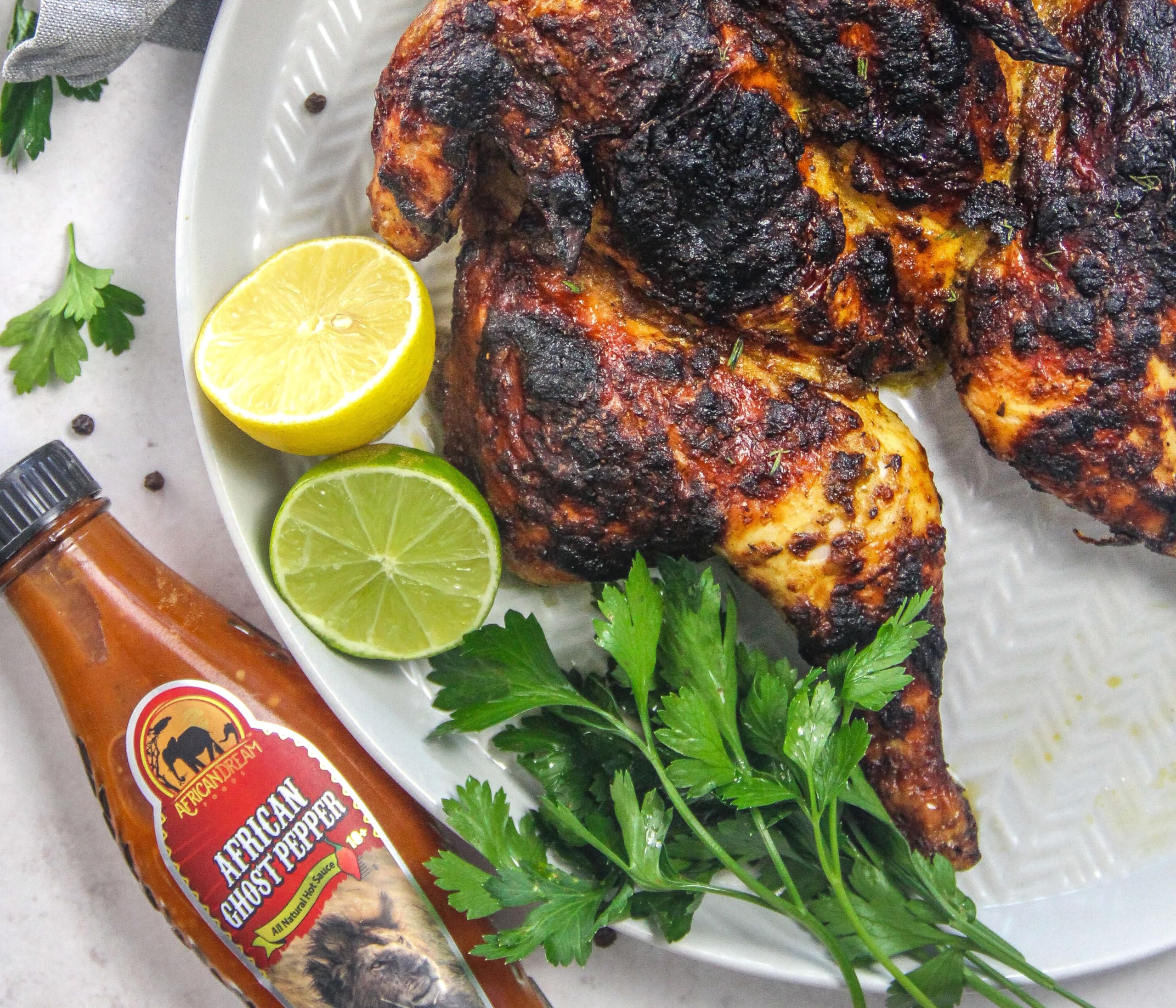 African Ghost Pepper Hot Sauce by African Dream Foods - Extremely Spicy Vegan & Non-GMO Sauce (5 fl oz Glass Bottle) - Perfect for Wings, Tacos, Chili & Cooking