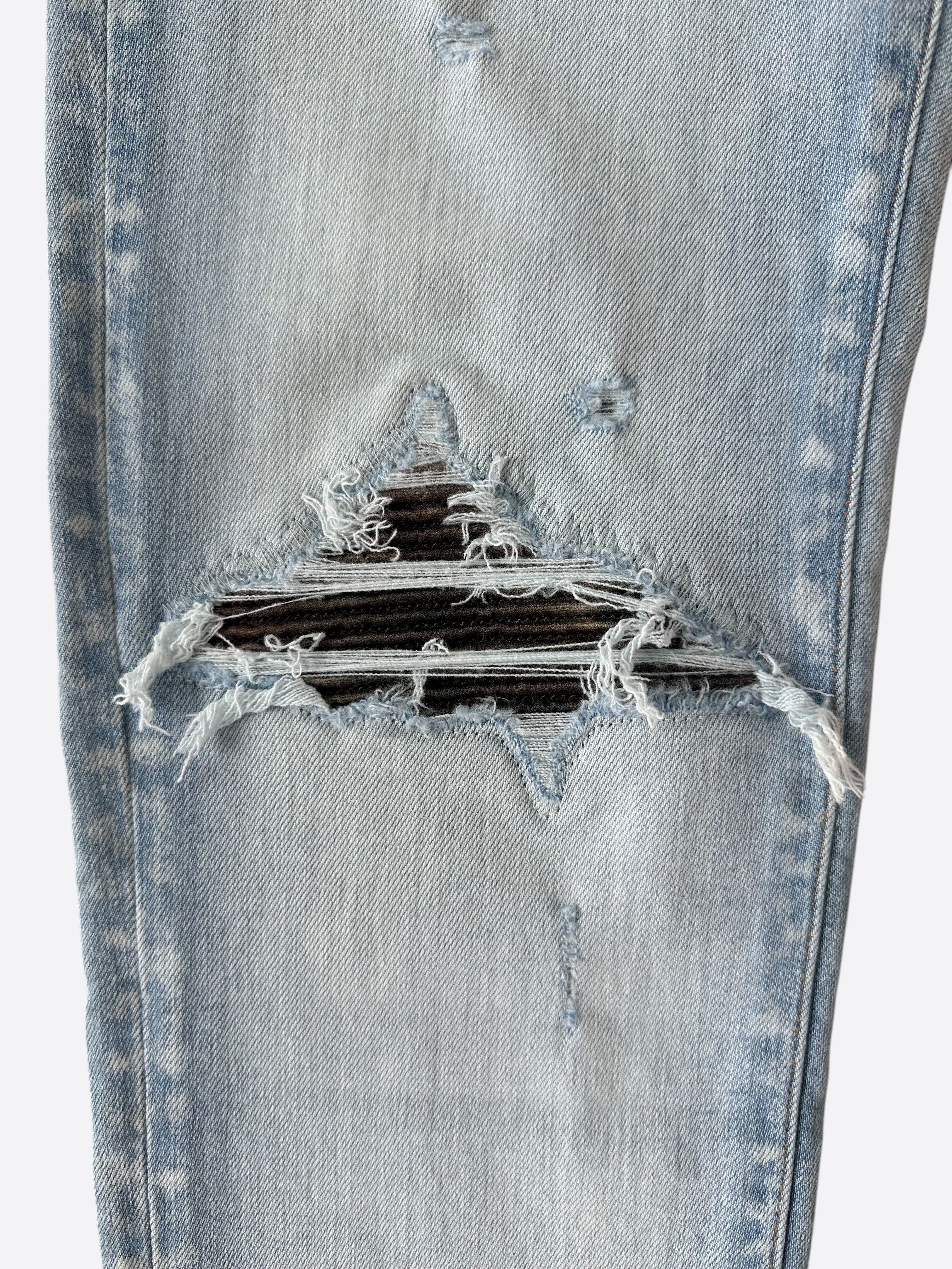 Amiri Light Indigo Camouflage Patch MX1 Jeans for Men - Premium Distressed Denim Pants with Camo Details | Perfect for Streetwear & Casual Outfits