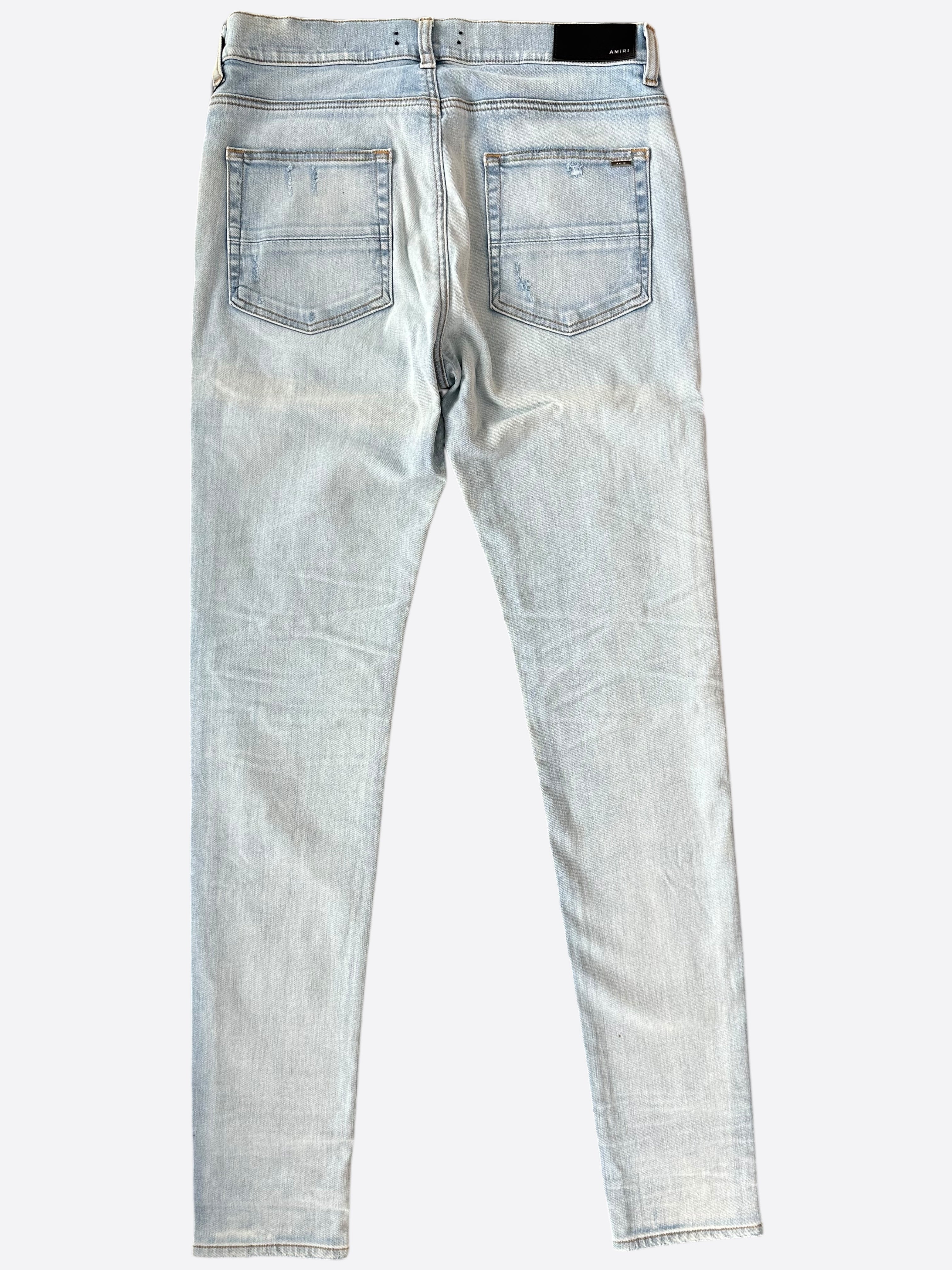 Amiri Light Indigo Camouflage Patch MX1 Jeans for Men - Premium Distressed Denim Pants with Camo Details | Perfect for Streetwear & Casual Outfits