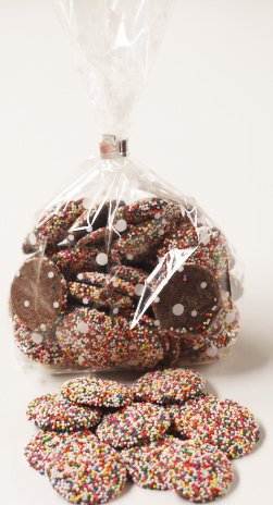Scott's Cakes Milk Chocolate Wafers with Rainbow Non-Pareils - 8 oz. White Polka Dot Bag - Perfect for Birthday Parties, Gift Giving & Dessert Toppings