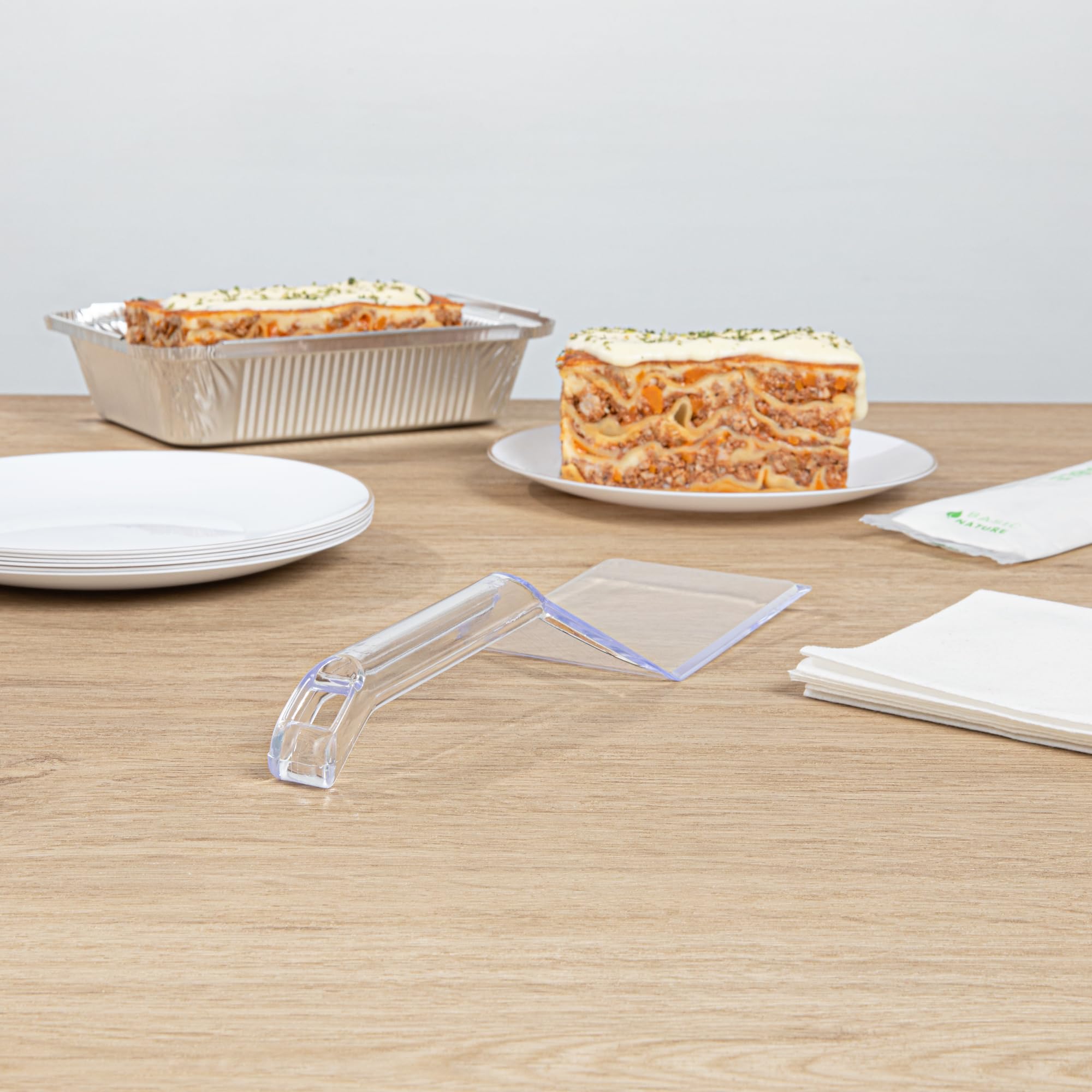 Restaurantware Cater Tek 10 Inch Disposable Serving Spatulas - 100 Pack Heavy-Duty Clear Plastic Lasagna Spatulas with Wide Edge & Comfortable Handle for Brownies, Cakes, Eggs - Perfect for Catering, Buffets, and Food Service