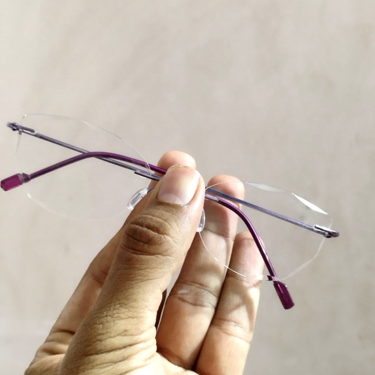 Stylish Purple Cat Eye Rimless Glasses with Diamond Cut Edges - Trendy Women's Fashion Eyewear for Work, Party & Everyday Wear