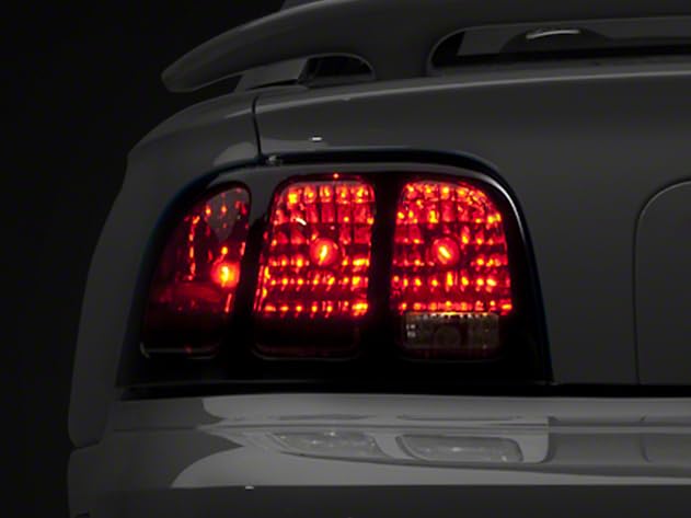 Raxiom Smoked Tail Lights Assembly for Ford Mustang 1996-1998 - LED Brake Lights with Iconic Design - Upgrade Your Mustang's Rear Style for Night Driving & Car Shows