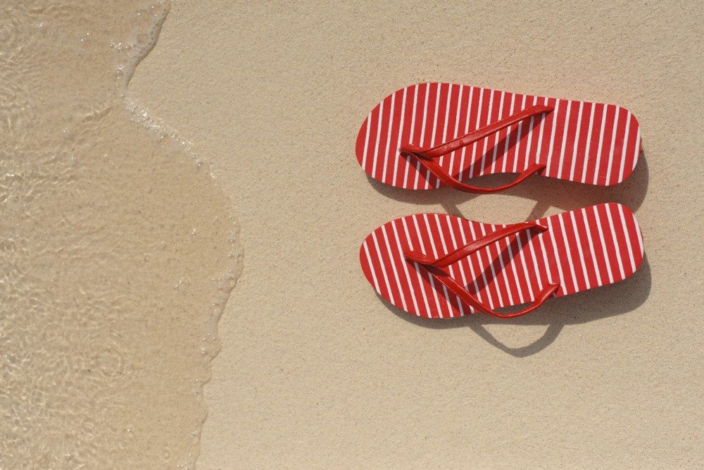 Lantern Press Red Flip Flops in Sand - 16x24 Wrapped Canvas Wall Art for Beach House Decor, Coastal Living Room, Summer Vacation Home