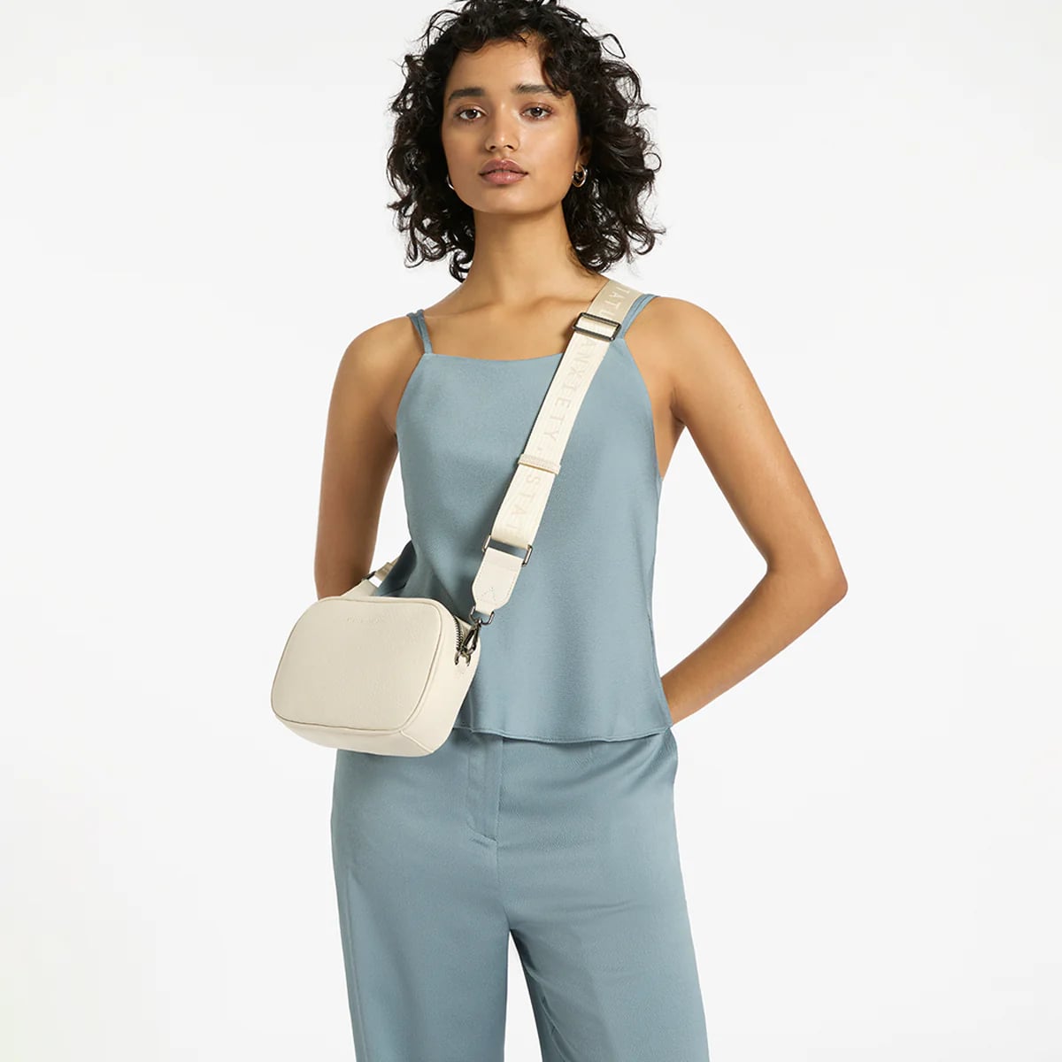 Status Anxiety Plunder Crossbody Bag with Webbed Strap in Chalk - Perfect for Everyday Use, Work, and Travel