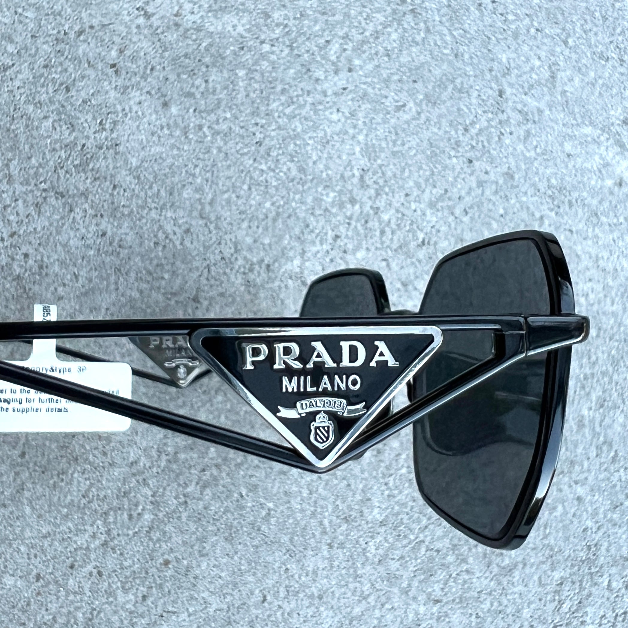 PRADA PRA51S Rectangle Logo Polarized Sunglasses - Black Aviator Style for Men & Women | UV Protection, Fashion Accessory for Driving, Beach & Outdoor Activities