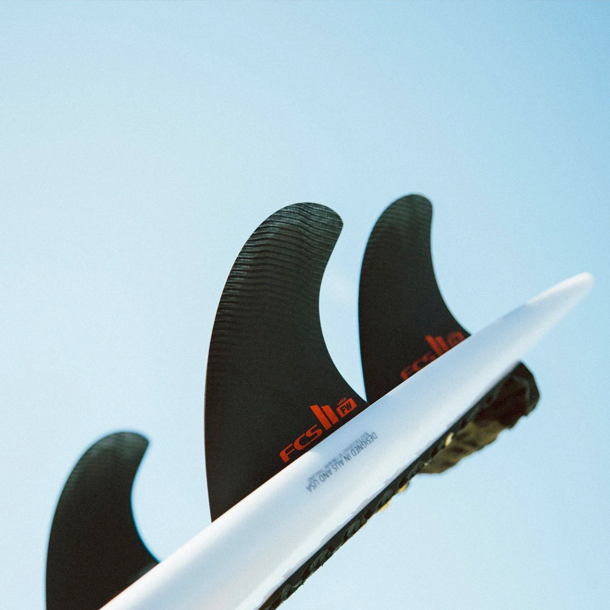 FCS II THRUSTER Firewire Surfboard Fins - PC Black Tri Fin Set (Medium Size) | Perfect for Shortboard Surfing & Performance Waves