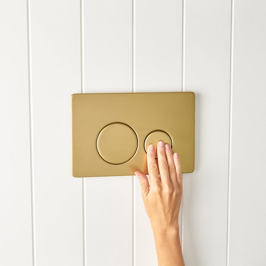 Elegant Curved In-Wall Toilet with Round Brushed Brass Buttons - Modern Space-Saving Bathroom Solution for Small Spaces & Luxury Homes