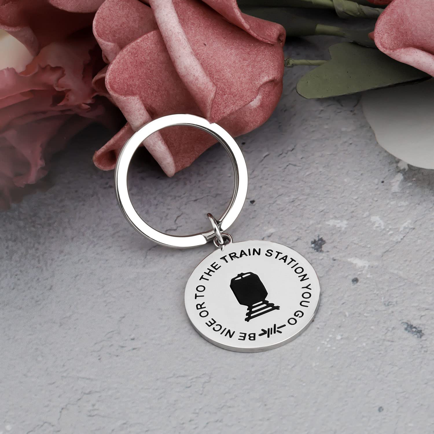 Funny TV Show Inspired Keychain - 'Be Nice Or To The Train Station You Go' Quote - Perfect Gift for TV Show Fans & Pop Culture Enthusiasts - Great for Keyrings, Backpacks, and Fan Collections