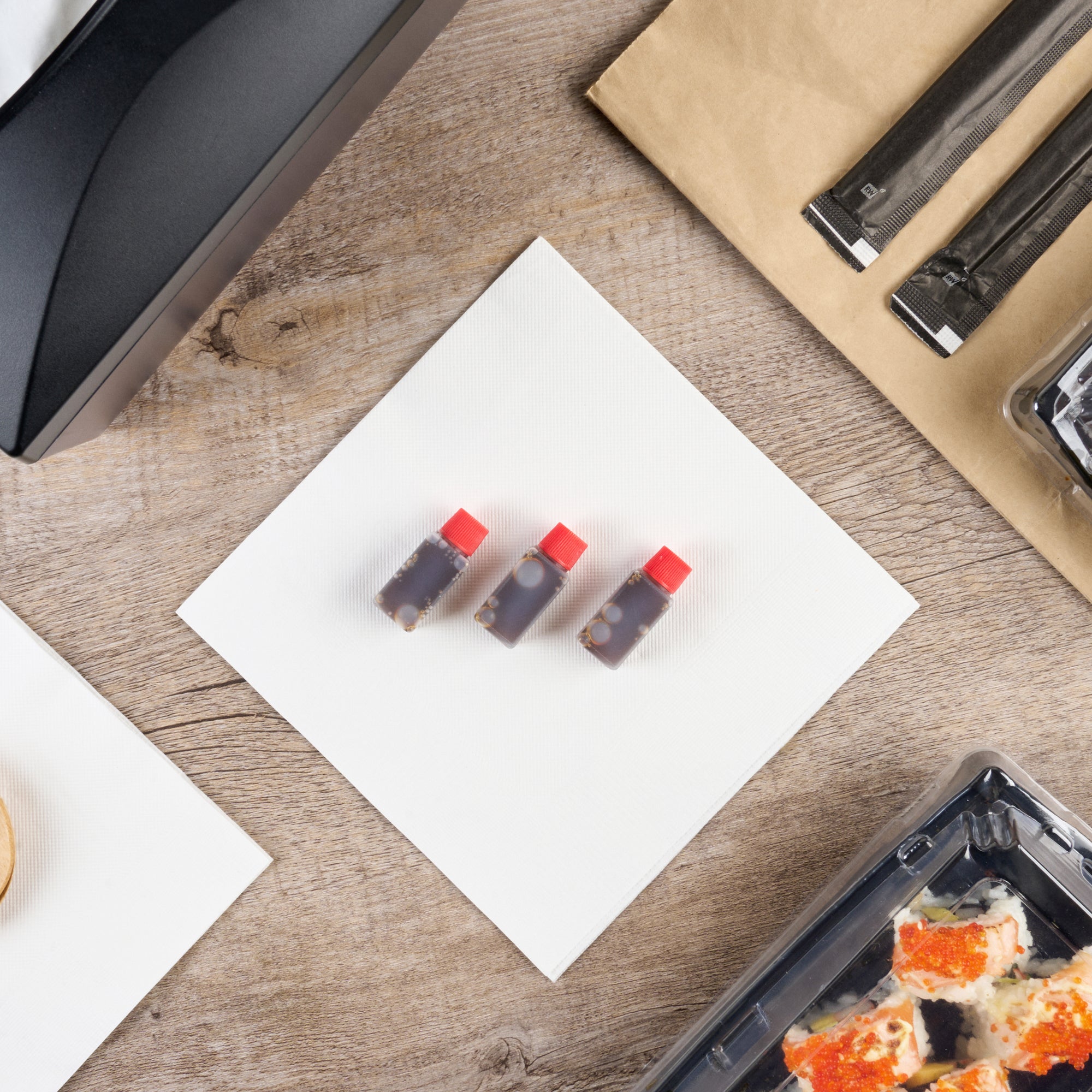 Bento Tek 6mL Clear Plastic Soy Sauce Bottles with Red Caps - 1/2