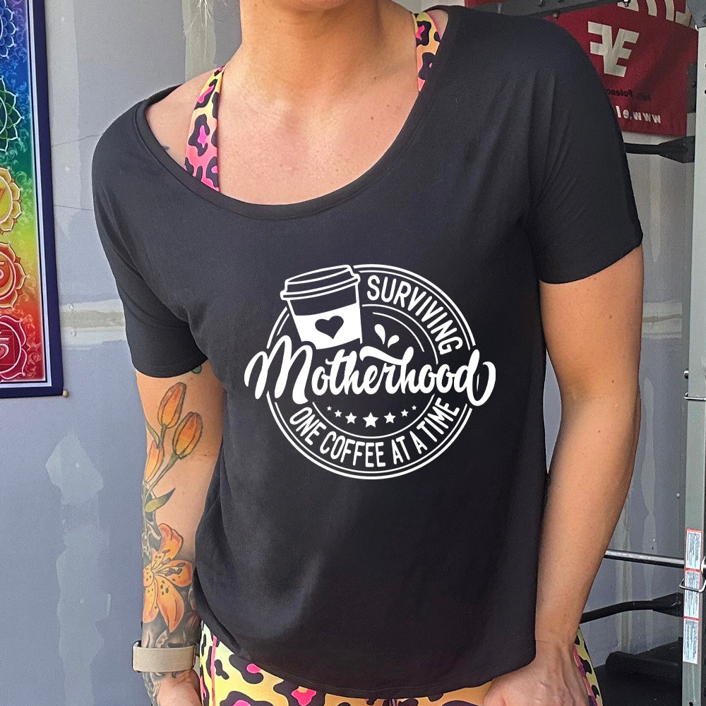 Surviving Motherhood One Coffee at a Time - Comfortable Slouchy T-Shirt for Moms | Relaxing at Home, Running Errands, Coffee Dates