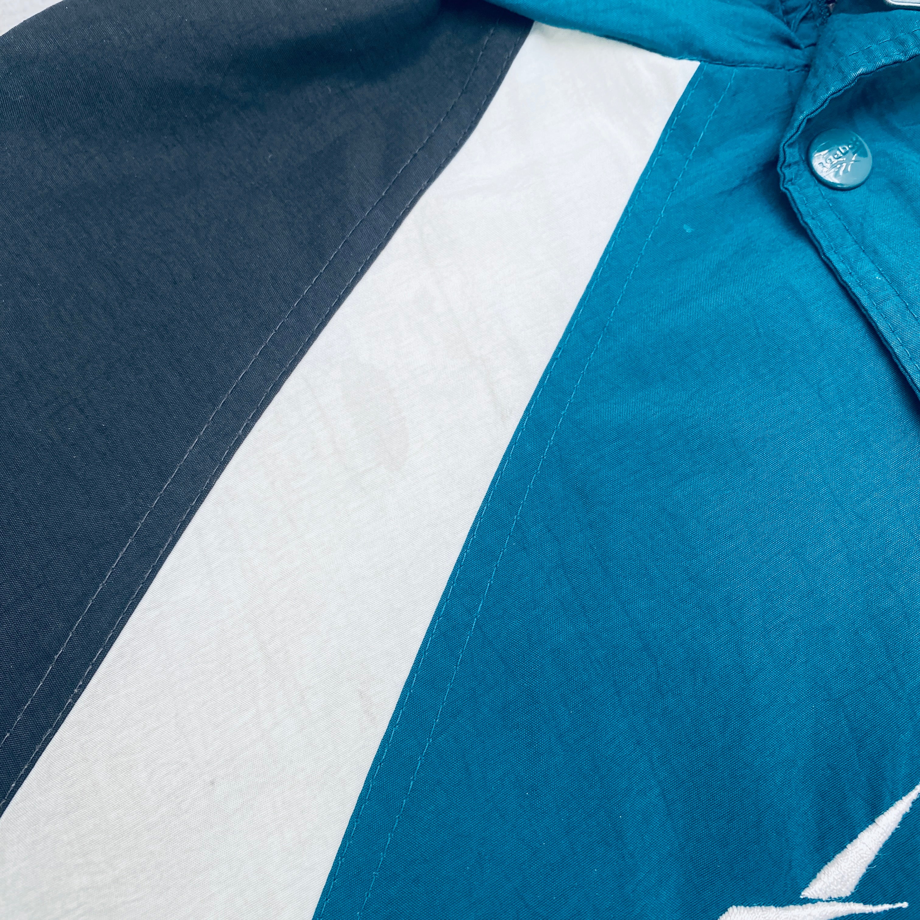 Philadelphia Eagles 1990s Reebok Reverse Spellout Full-Zip Proline Jacket for Men - Vintage NFL Football Fan Gear for Game Day & Casual Wear