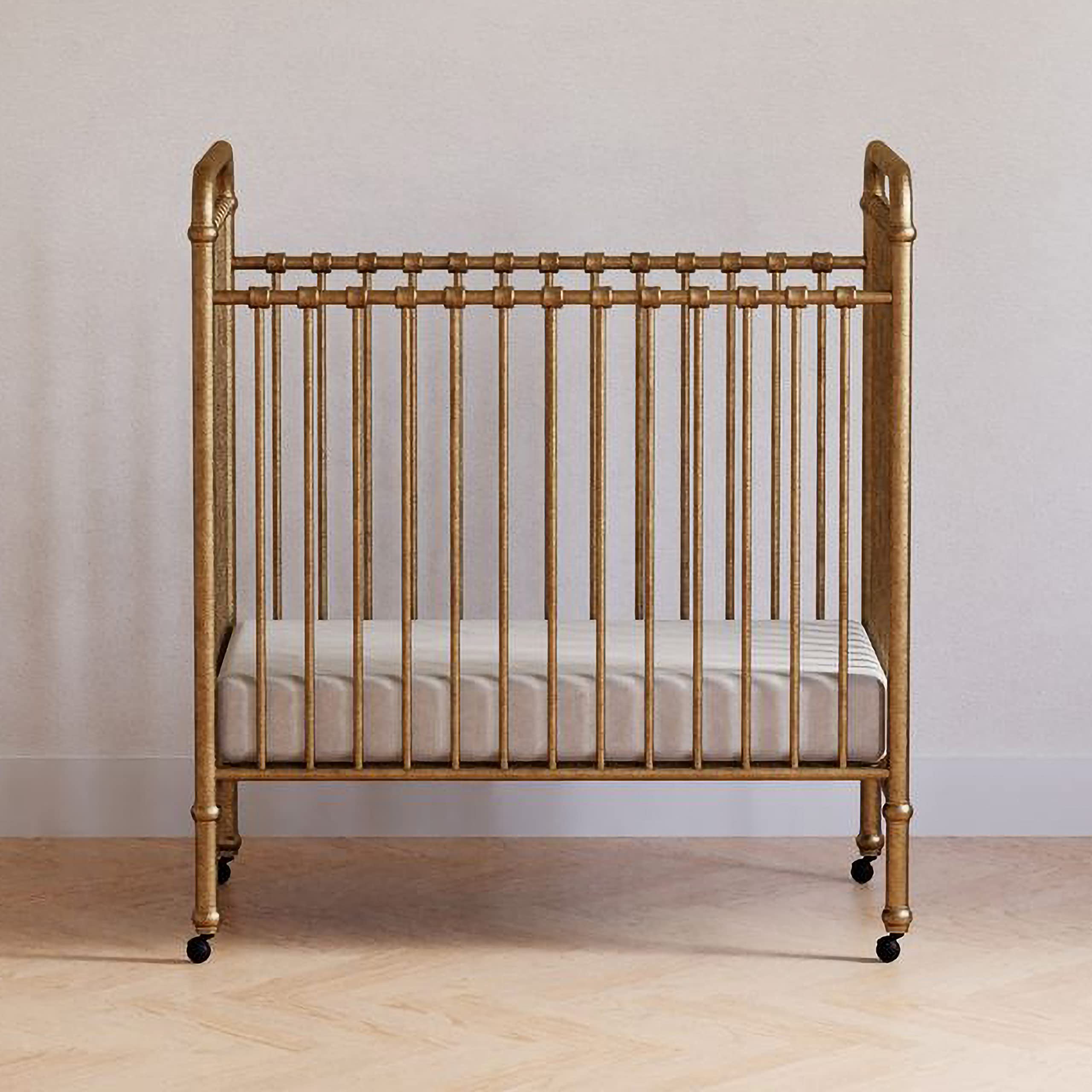NAMESAKE Abigail 3-in-1 Convertible Mini Metal Crib in Vintage Gold - Greenguard Gold Certified Safe Nursery Furniture for Small Spaces | Perfect for Apartments, Nursery Rooms & Guest Bedrooms