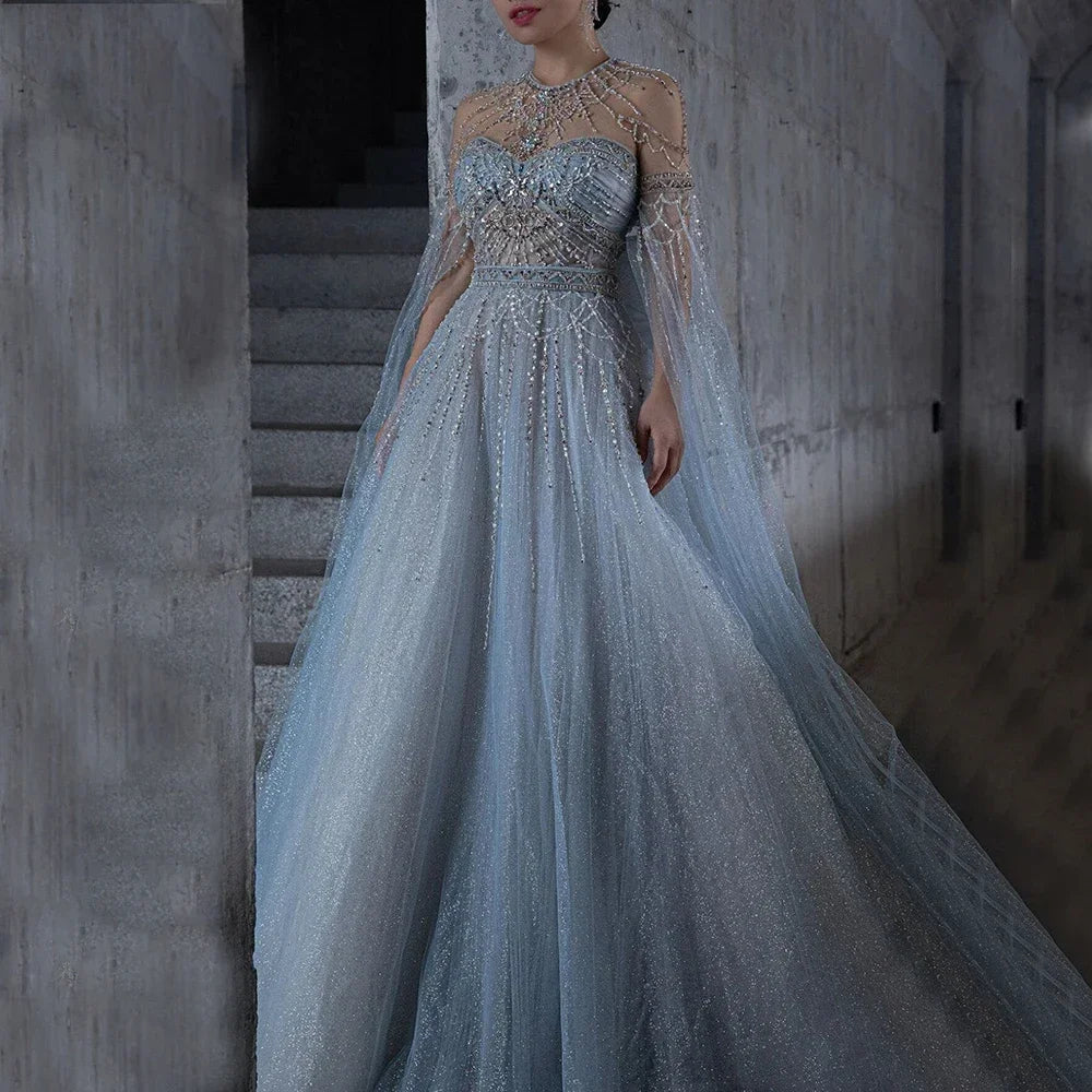 Elegant Blue A-Line Arabic Cape Sleeve Evening Gown with Beaded Bow Detail - Luxury Formal Dress for Women 2025 | Perfect for Weddings, Galas & Special Occasions