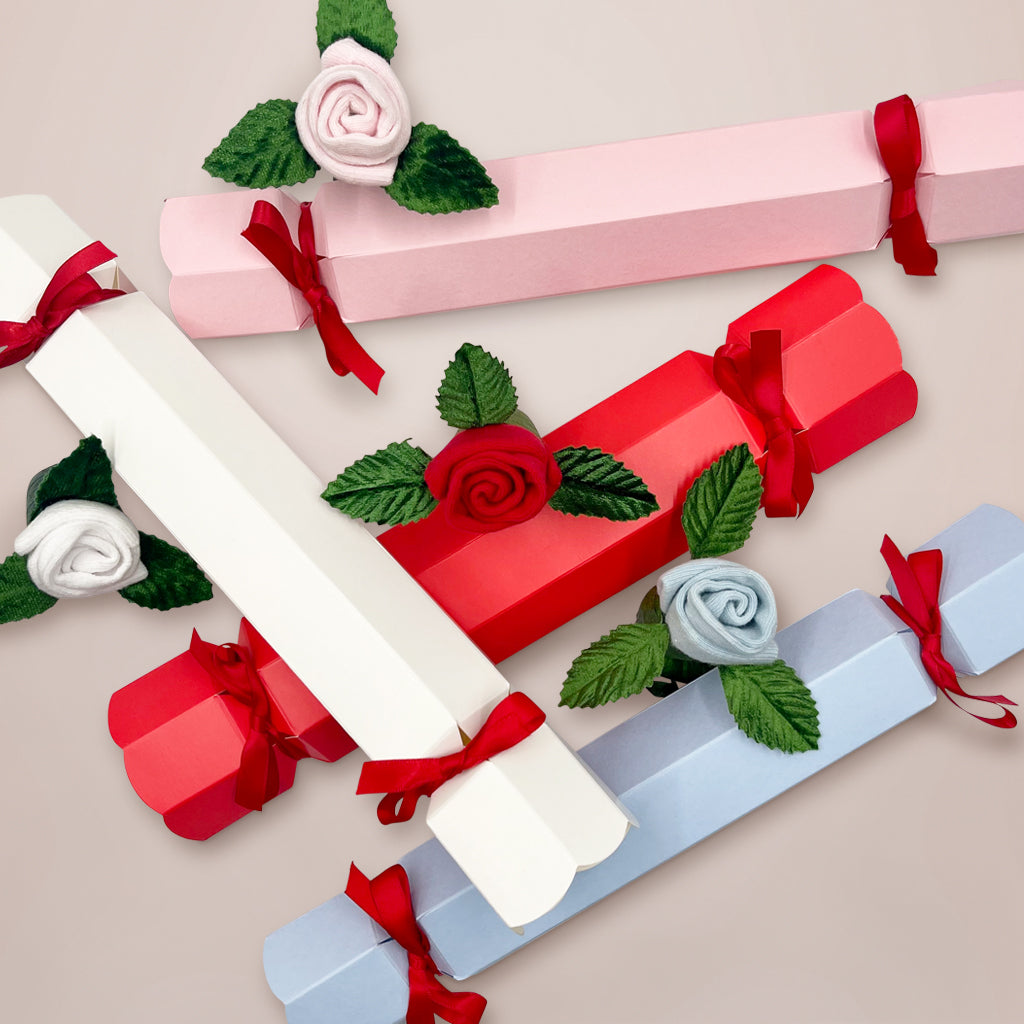 Baby's First Christmas Rosebud Sock Cracker - Blue Holiday Gift for Newborns & Infants - Perfect for Christmas Stockings, Photo Props & Keepsakes