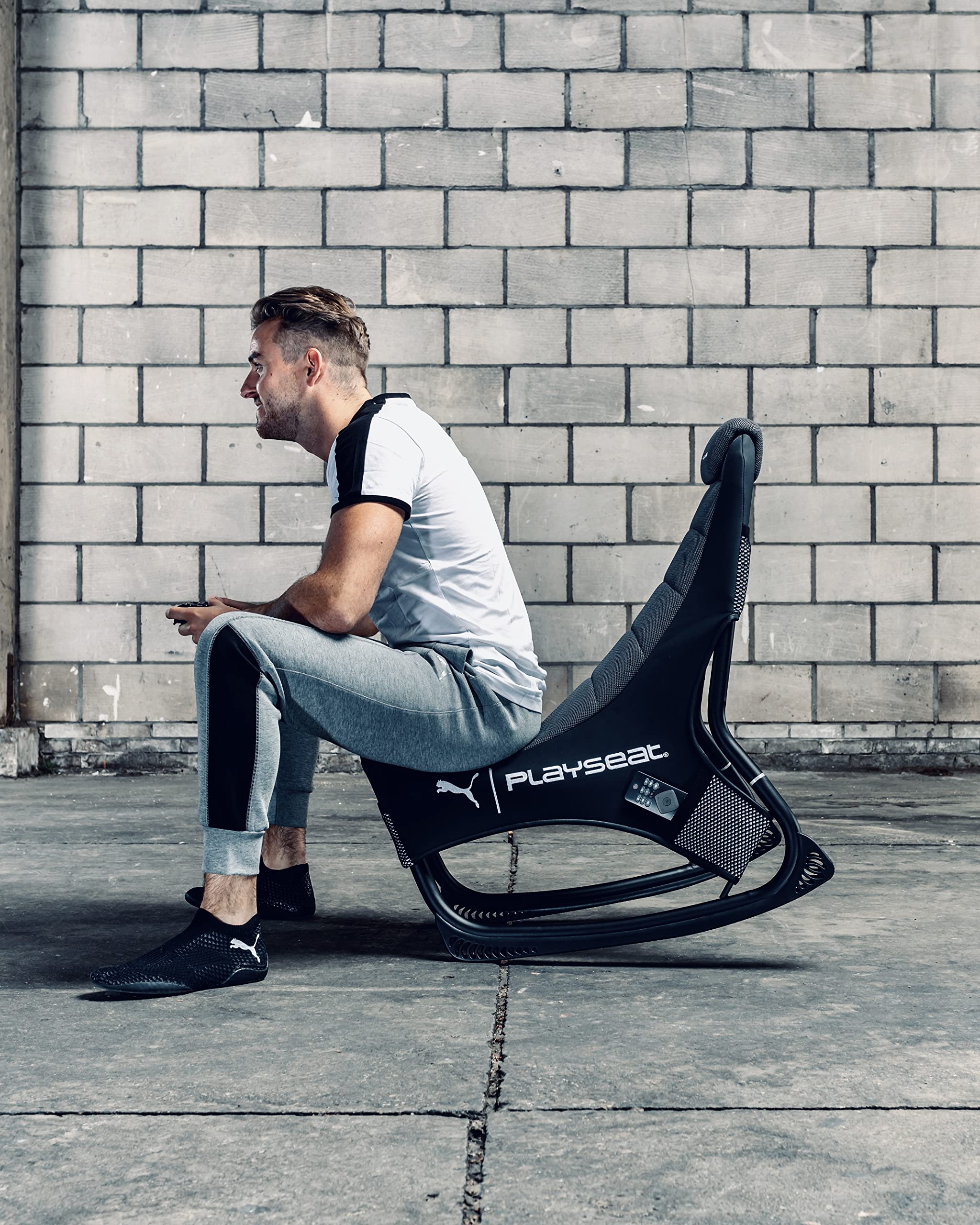 PLAYSEAT Puma Active Gaming Chair - Ergonomic ActiFit Material for Maximum Comfort & Freedom of Movement | Gaming Accessory Pockets | Premium Black Racing Seat for PC, PS5, Xbox Gaming Setup | Perfect for Esports & Long Gaming Sessions