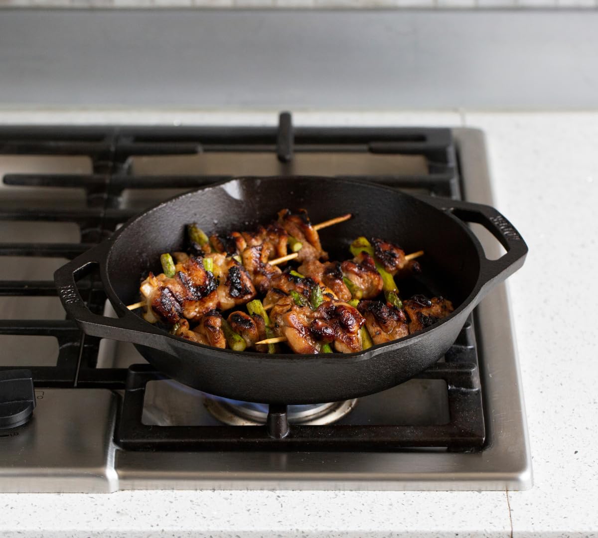 Lodge 12 Inch Pre-Seasoned Cast Iron Grill Pan with Dual Handles - Perfect for Stovetop, Oven & Outdoor Cooking - Ideal for Grilling Steaks, Burgers & Vegetables