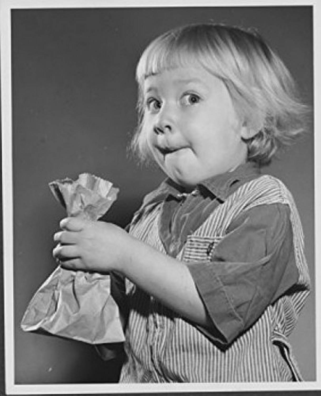 Close-Up of Girl Holding Paper Bag - 18x24 Poster Print - Wall Art for Home, Office & Classroom Decor