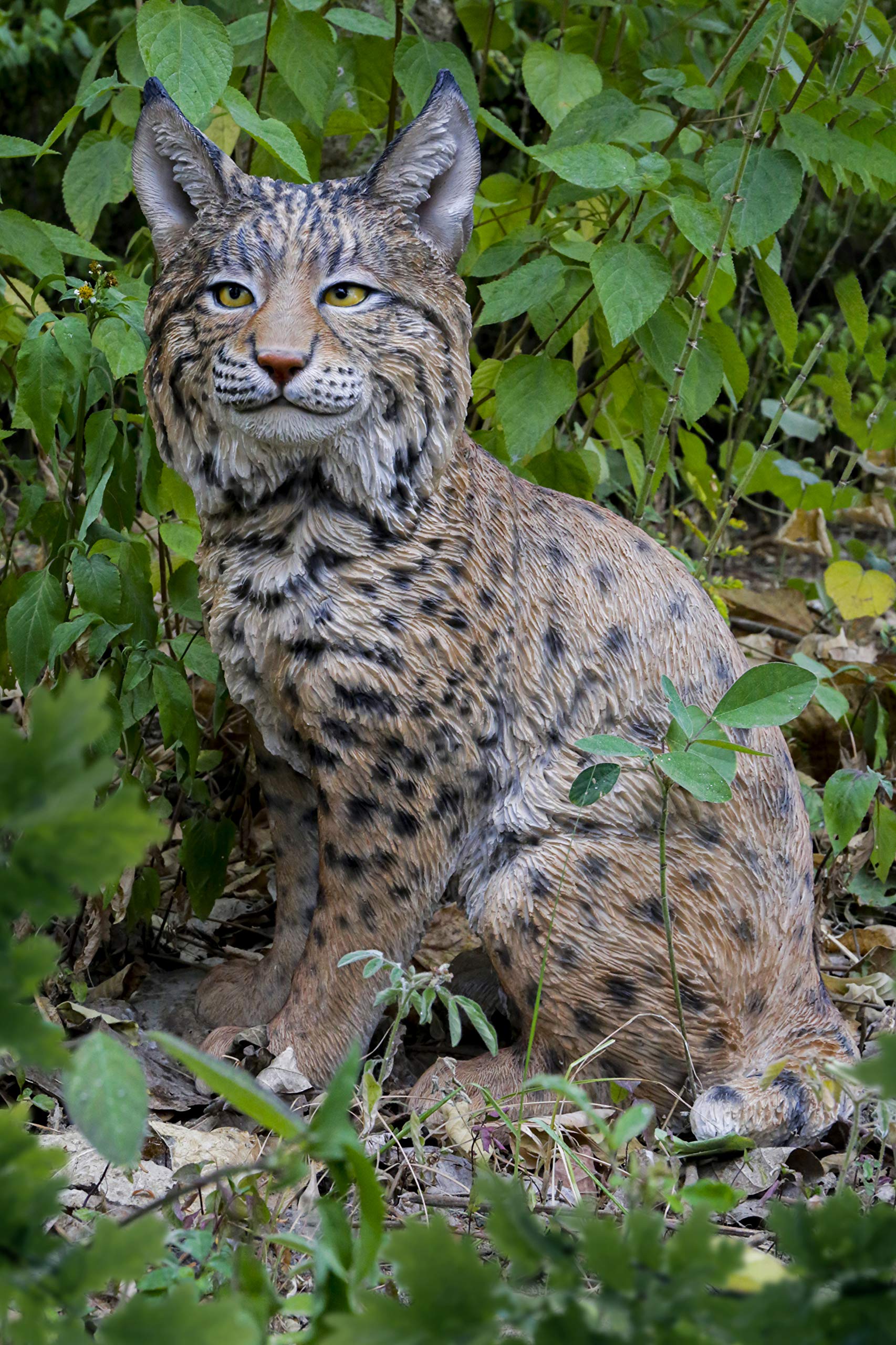 Hi-Line Gift Ltd. Sitting Bobcat Statue - Realistic Yellow and Black Decorative Figurine for Home, Office, or Garden Decor