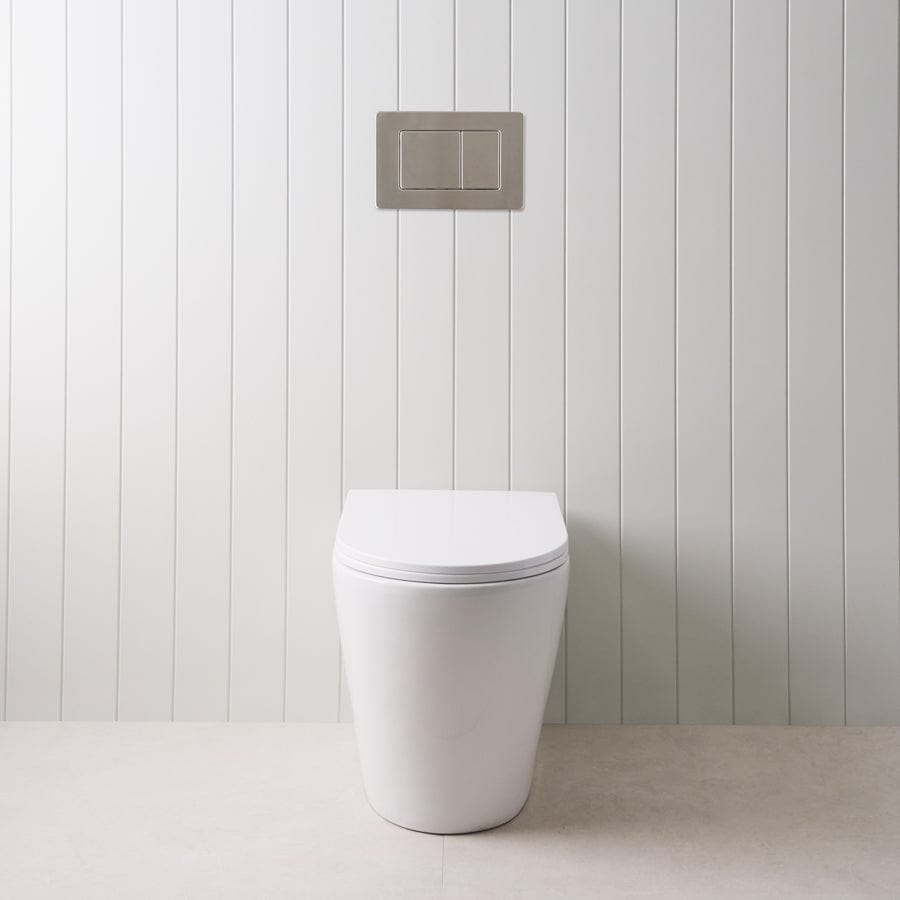 Stylish Curved In-Wall Toilet with Round Gunmetal Buttons - Modern Space-Saving Bathroom Solution for Small Homes and Luxury Apartments