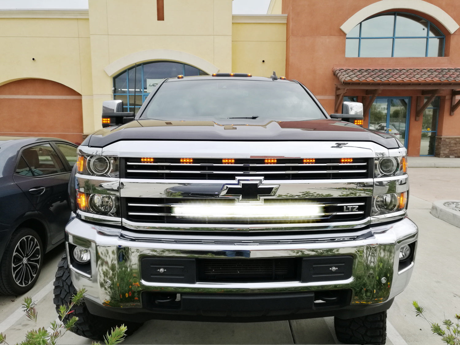 150W 30-Inch CREE LED Light Bar with Behind Grille Mounting Bracket & Wiring Harness - Compatible with Chevy Silverado 1500/2500/3500 - Perfect for Off-Roading, Hunting, and Night Driving