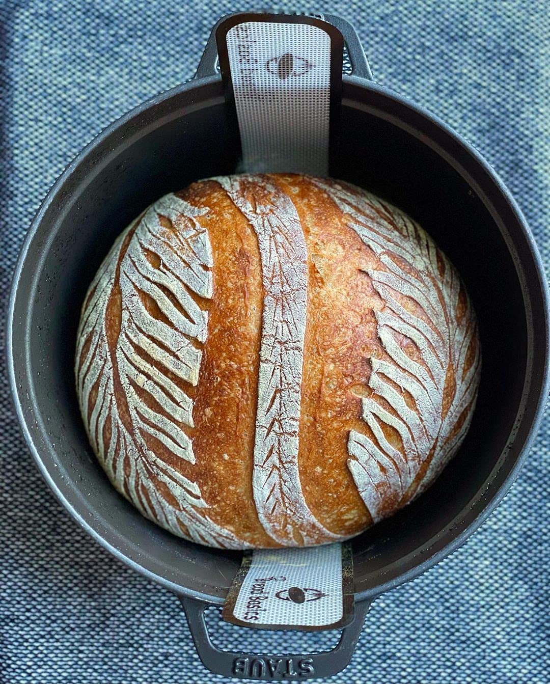Non-Stick Silicone Baking Mat for Dutch Oven Bread Baking - Reusable, Eco-Friendly Parchment Paper Alternative with Storage Band & Long Handles (9.4 Inch) - Perfect for Homemade Artisan Bread, Pizza Dough & Pastry Making - Easy Clean & Safe Dough Transfer
