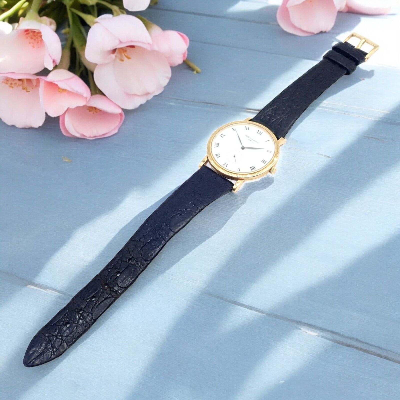Patek Philippe Calatrava 18k Yellow Gold Men's Watch with Roman Dial - Manual Wind Luxury Dress Watch for Formal Events & Business Occasions