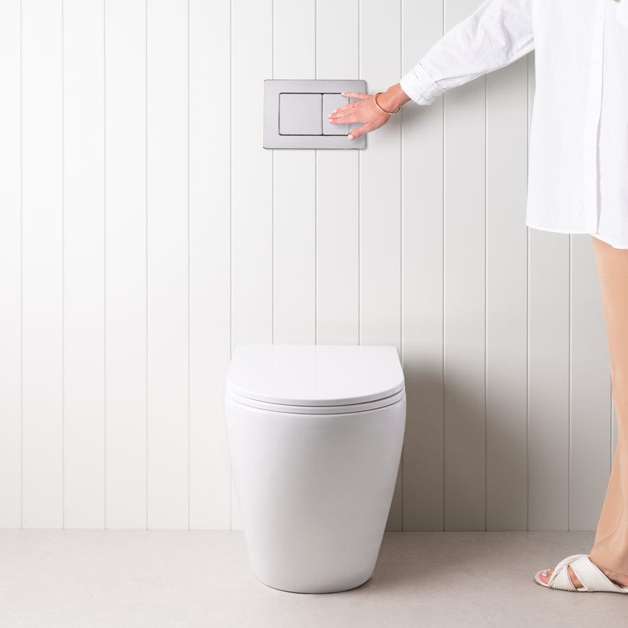 Modern Curved In-Wall Toilet with Sleek Rectangle Chrome Buttons - Space-Saving Bathroom Solution for Contemporary Homes