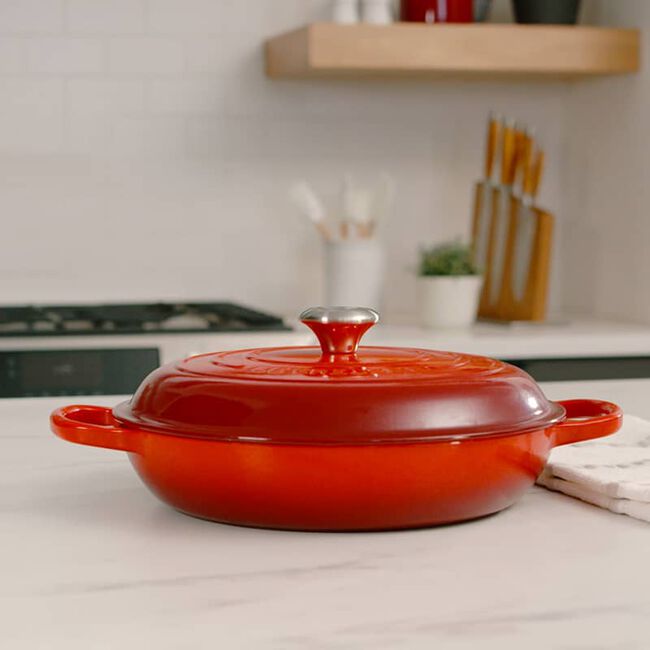 Le Creuset 4.7 Quart Enameled Cast Iron Braiser with Lid - Flame Color - Perfect for Searing, Braising & Slow Cooking - Stovetop to Oven Safe Cookware