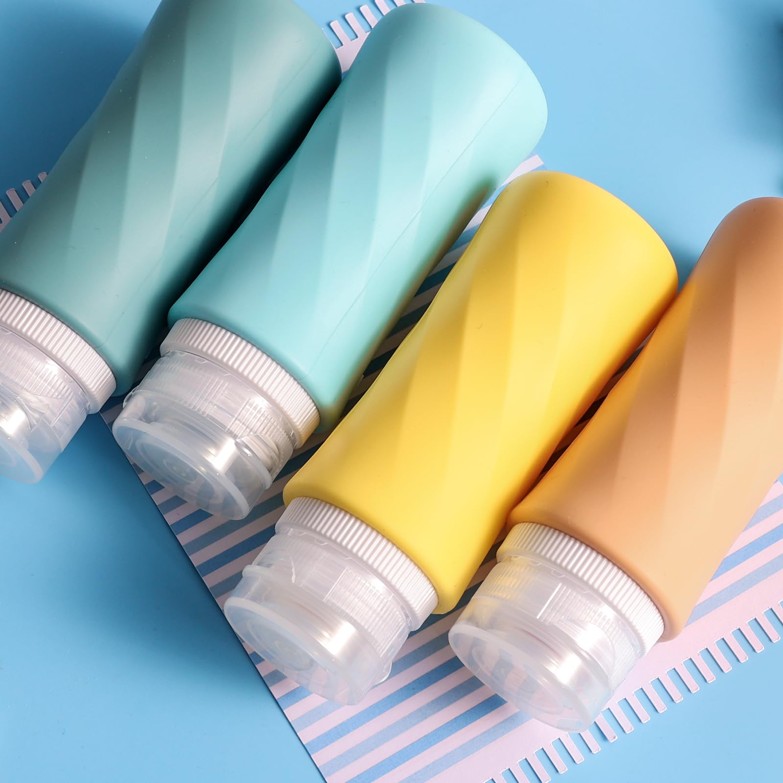 TSA Approved 3.3oz Travel Bottles for Toiletries - 4 Pack Leak Proof Squeezable Silicone Containers with Clear Toiletry Bag | BPA Free, Portable & Reusable | Perfect for Air Travel, Gym, Camping & Vacation Essentials
