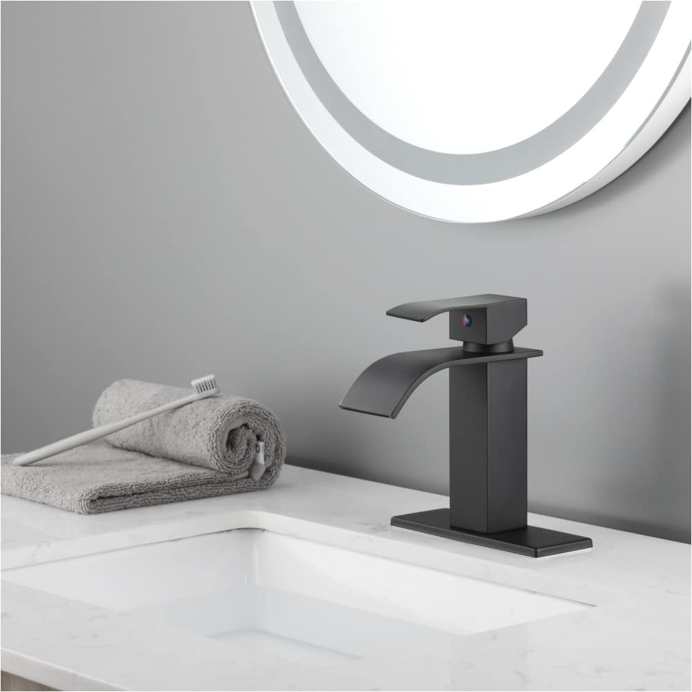 HuaZo Modern Bathroom Vanity Sink Faucet with Waterfall Spout - Single Handle Gold Bathroom Faucet for Bathroom Sink - Perfect for Home, Hotel & Spa Renovation