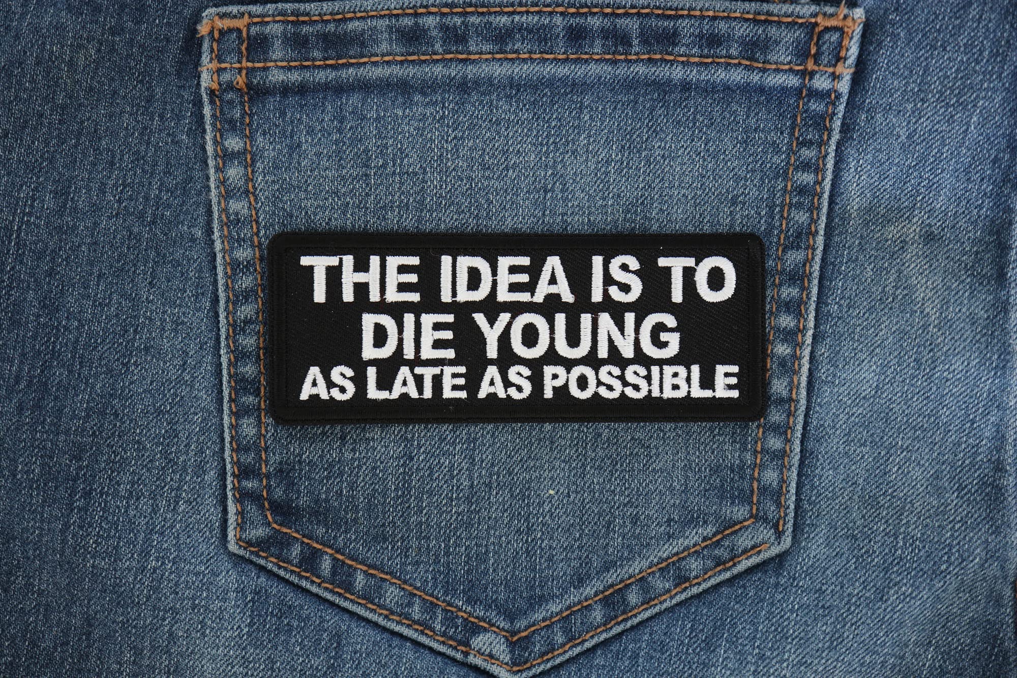 Biker Saying Patch - 'The Idea is to Die Young as Late as Possible' Iron-On Embroidered Patch for Jackets, Vests & Backpacks - Motorcycle Accessories for Bikers & Riders