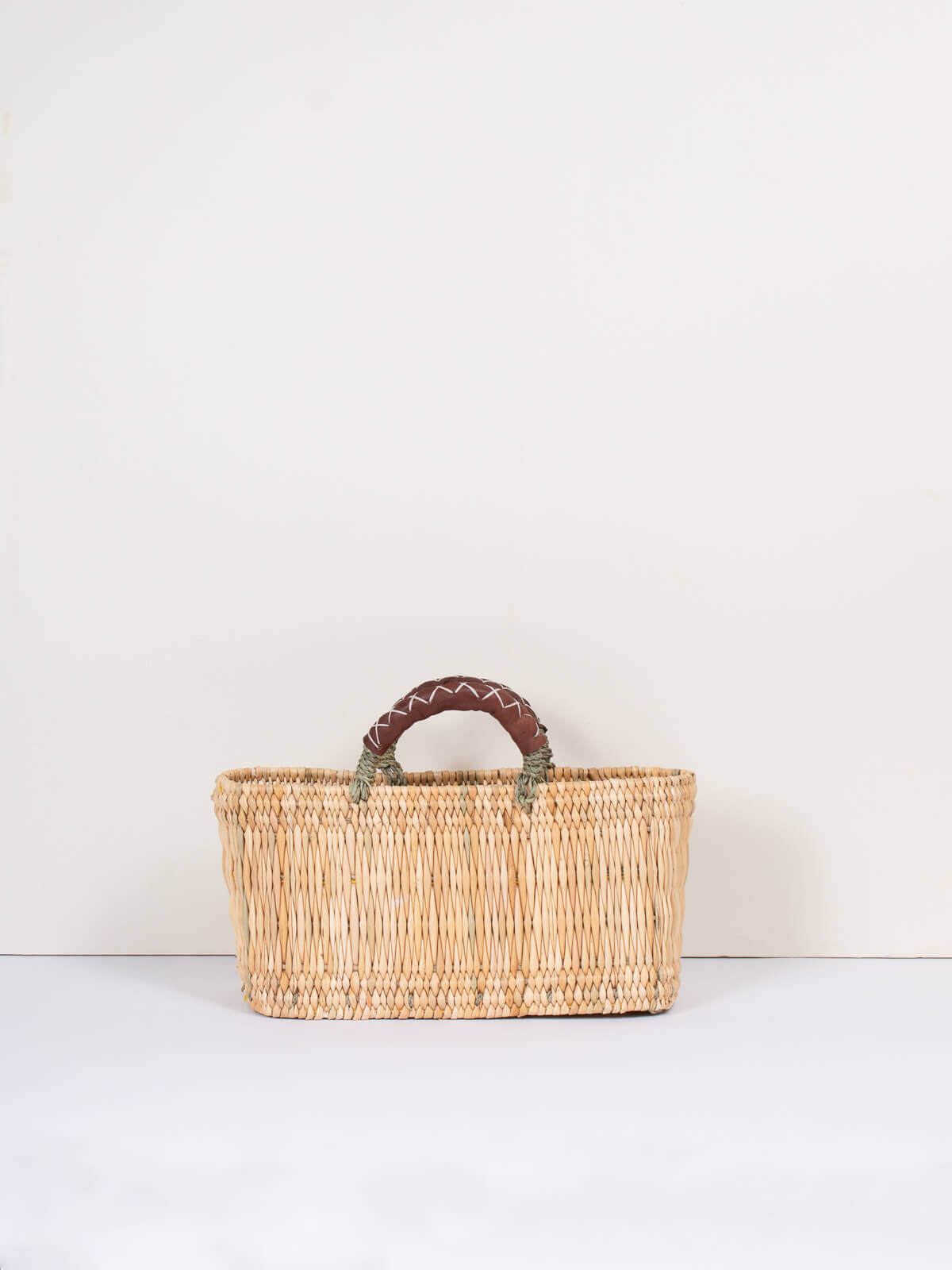 Handwoven Reed Basket with Genuine Leather Handles - Natural Woven Storage Bin for Home Decor, Laundry, or Picnic Basket - Perfect for Organizing Blankets, Toys, and More
