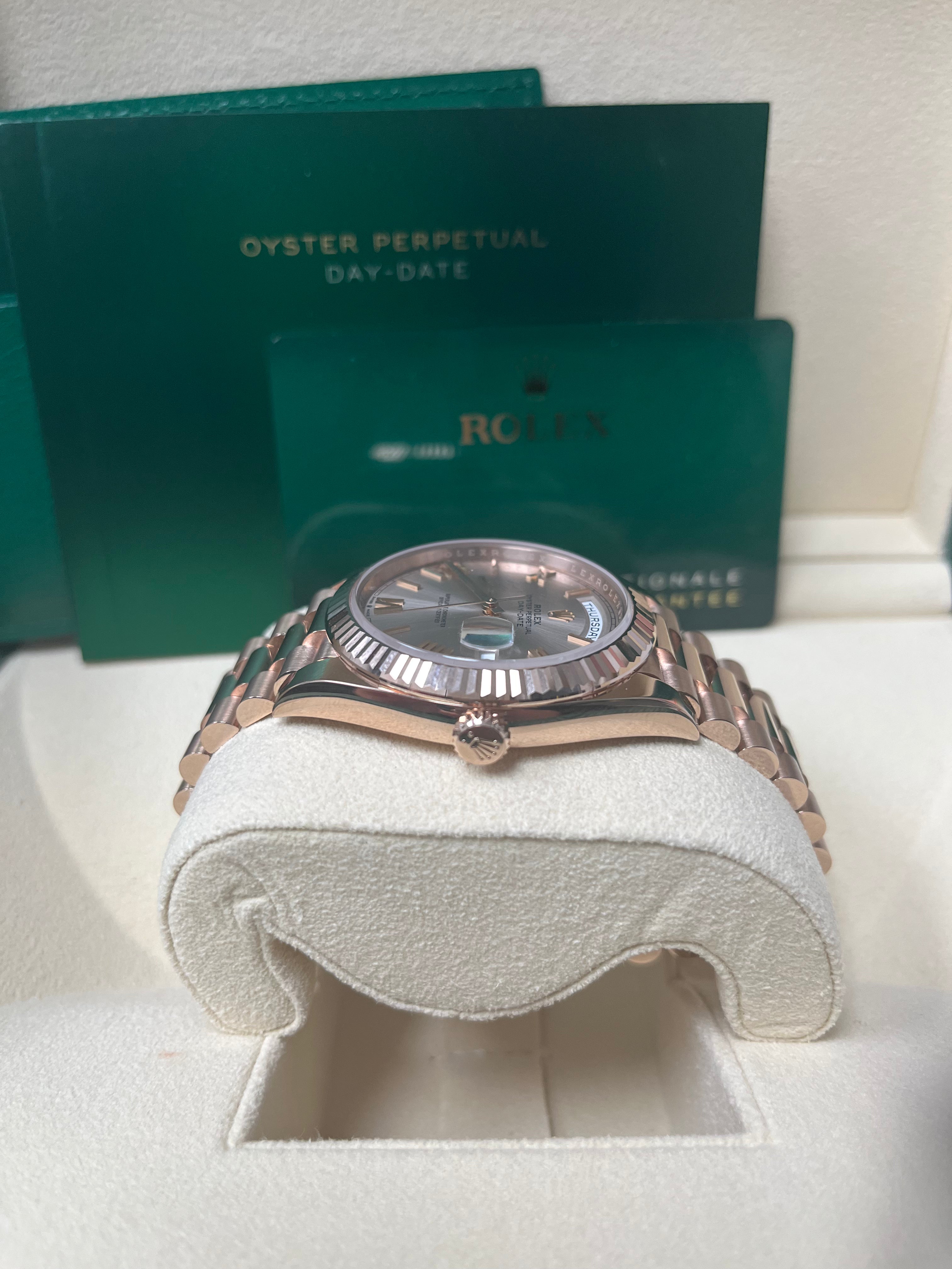 Rolex Day Date 40mm Rose Gold Watch with Sundust Roman Dial & Fluted Bezel (Ref #228235) - Luxury Dress Watch for Business & Formal Occasions