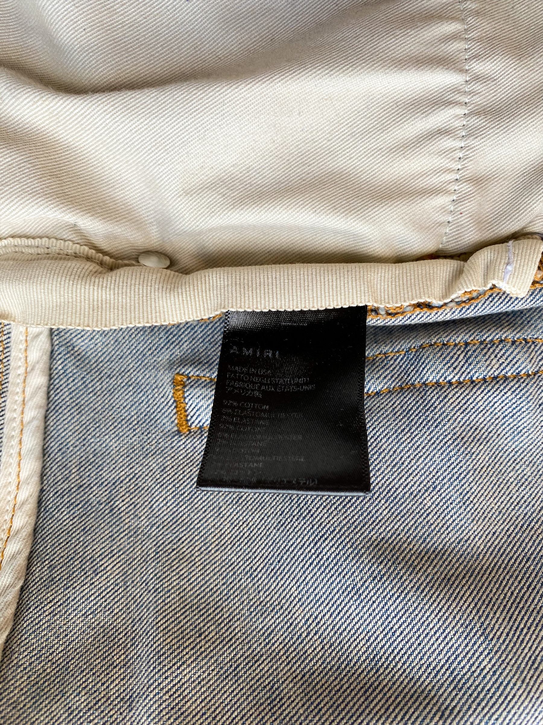 Amiri Logo Applique Blue Distressed Denim Jeans for Men - Stylish Vintage Washed Slim Fit Designer Jeans | Perfect for Casual Wear, Night Out and Street Fashion