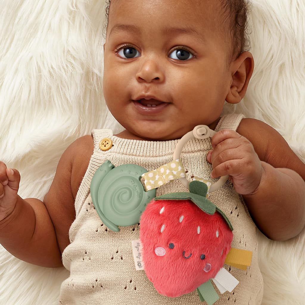 Itzy Ritzy Infant Toy & Teether - Soft Silicone Teething Toy with Lovey, Crinkle Sound & Textured Ribbons for Newborns & Babies (Strawberry) | Soothing Gum Relief & Sensory Play for Teething Infants