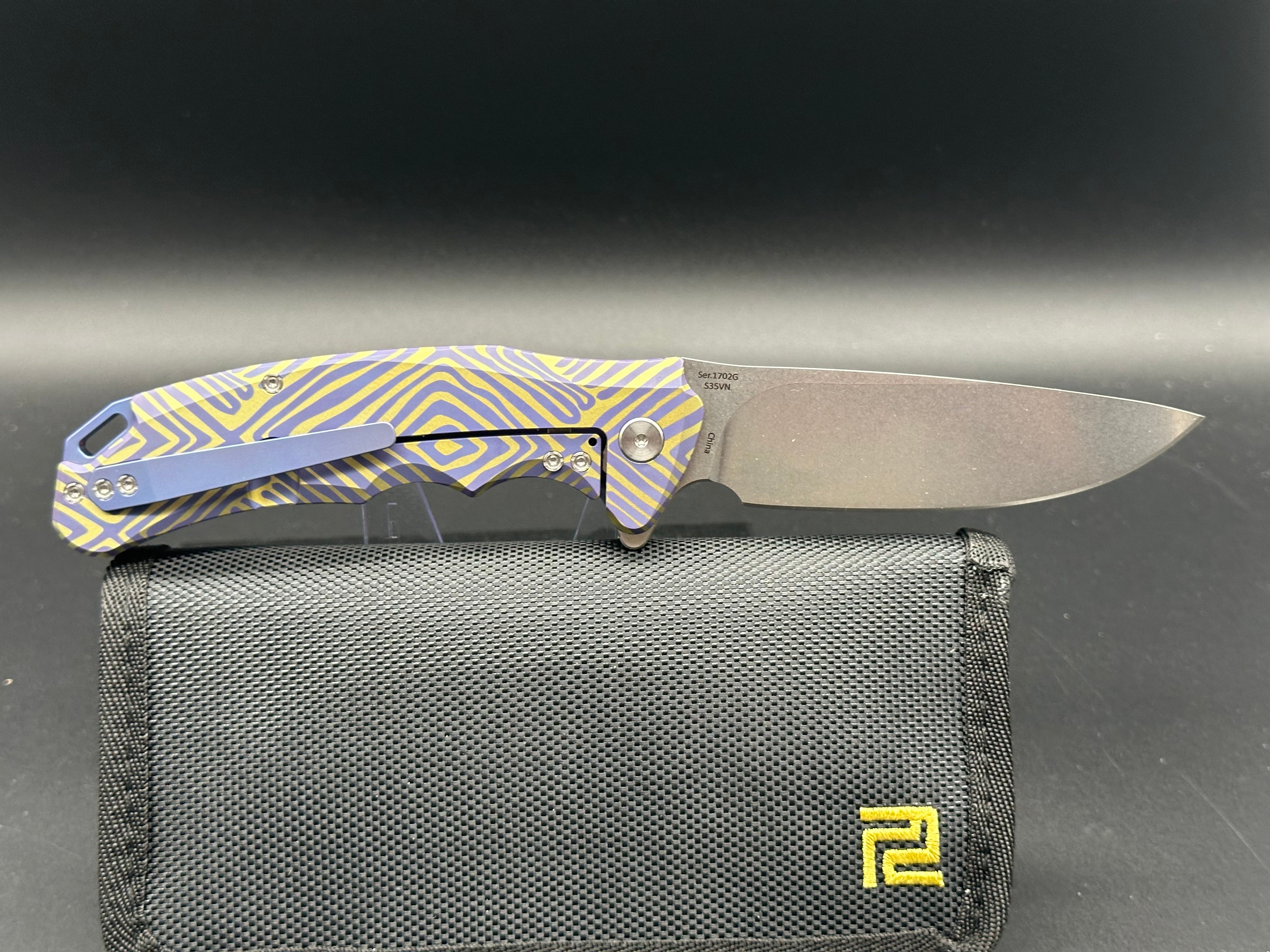 Artisan Cutlery Traditional S35VN Stainless Steel Drop Point Folding Knife with Gold & Blue Anodized Titanium Handle - Perfect for Camping, Hunting, and Everyday Carry (EDC)