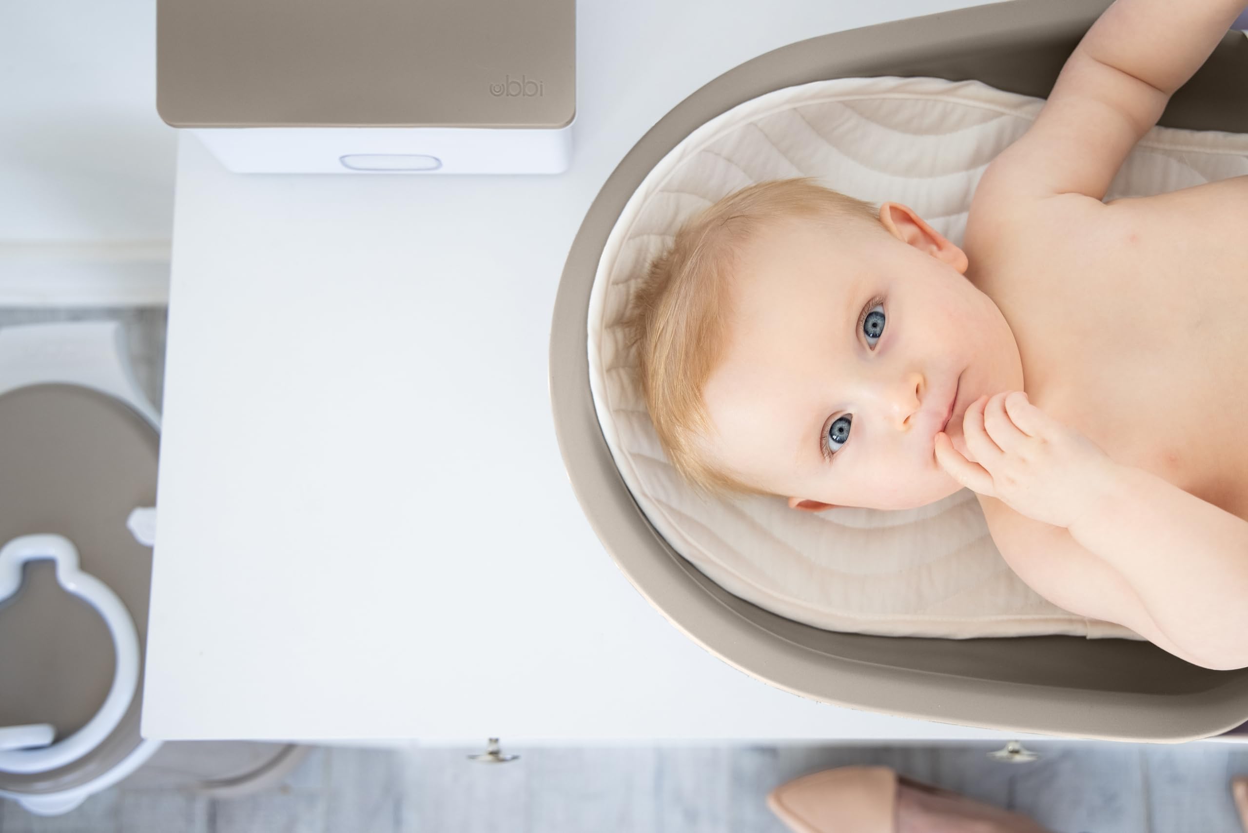 Ubbi Baby Changing Pad - Waterproof, Lightweight & Easy to Clean with Detachable Base | Includes Safety Strap & Non-Slip Feet | Perfect for Nursery, Travel & Diaper Changing Stations (Taupe)