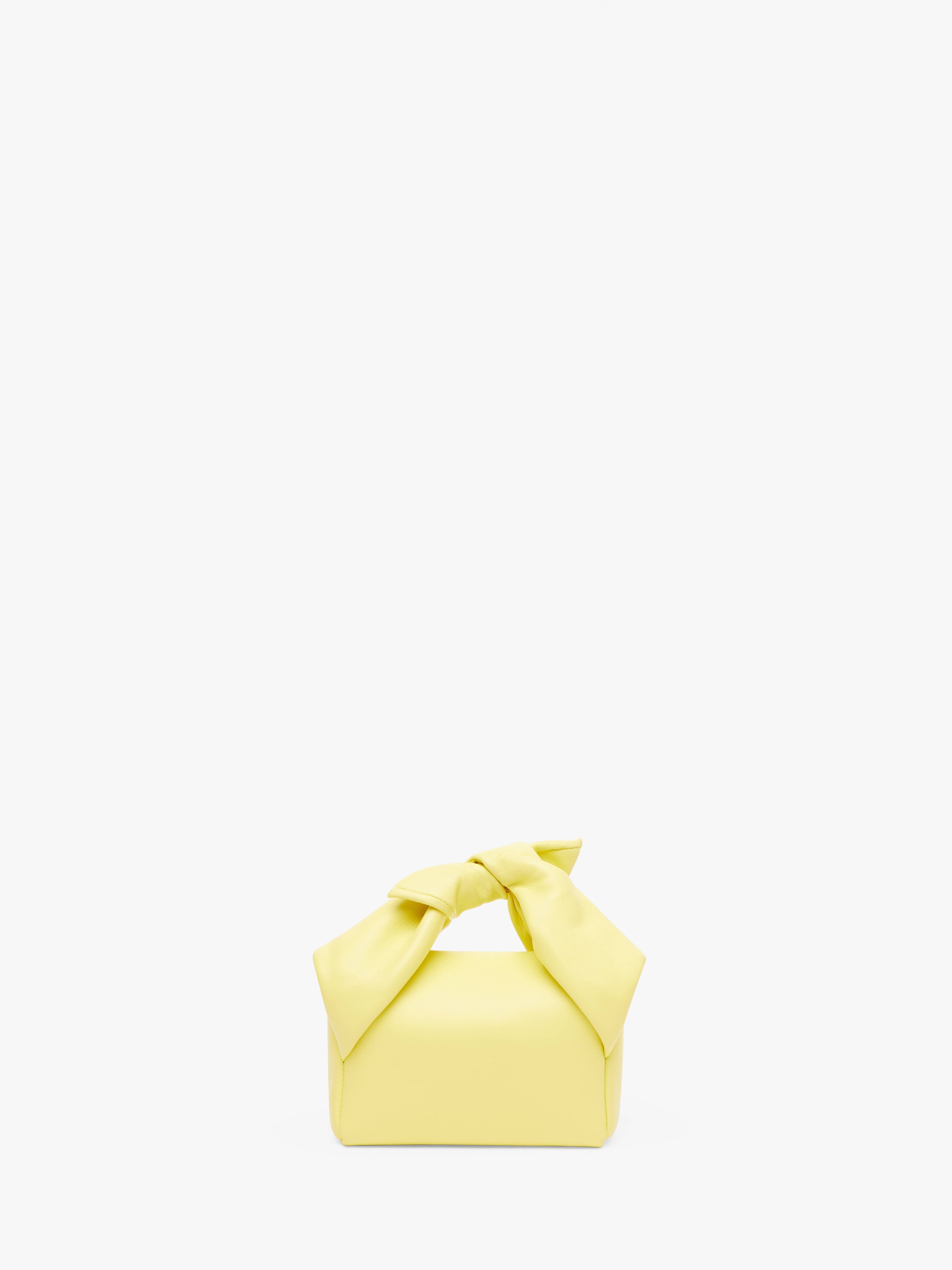 SMALL BOW TWISTER LEATHER TOP HANDLE BAG - Elegant Women's Handbag for Work, Party & Everyday Use