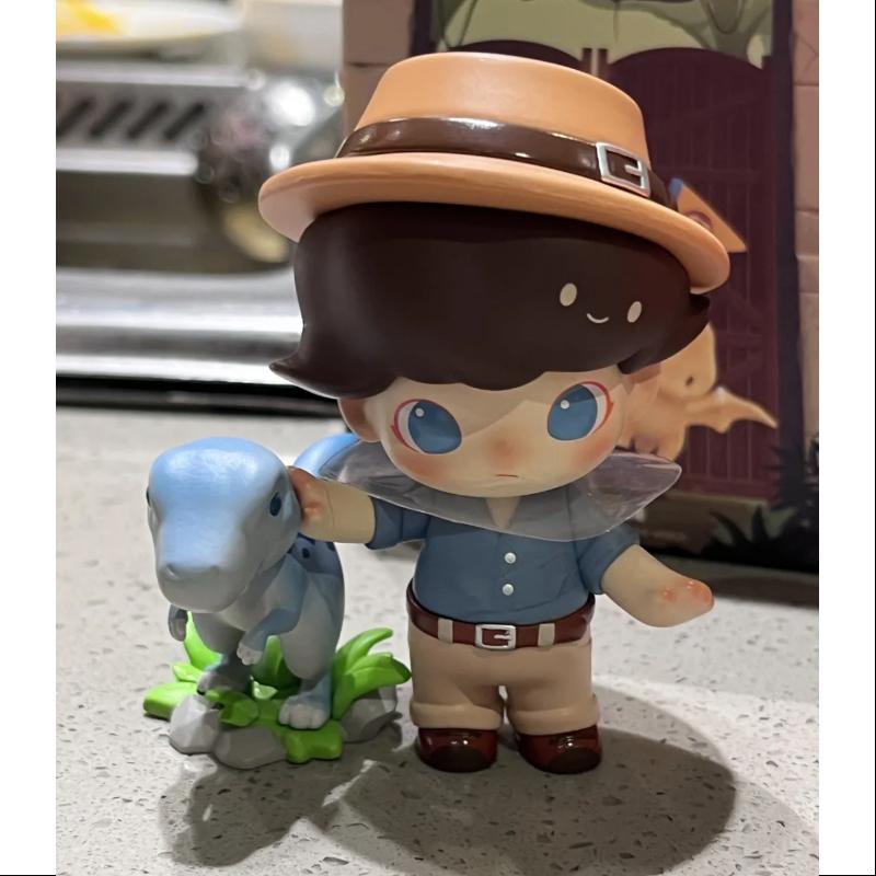 DIMOO Jurassic World Series DINOSAUR TRAINER Collectible Figure - Official Licensed Dinosaur Toys for Kids & Adults - Perfect for Display, Gifts, and Jurassic World Fans Collection