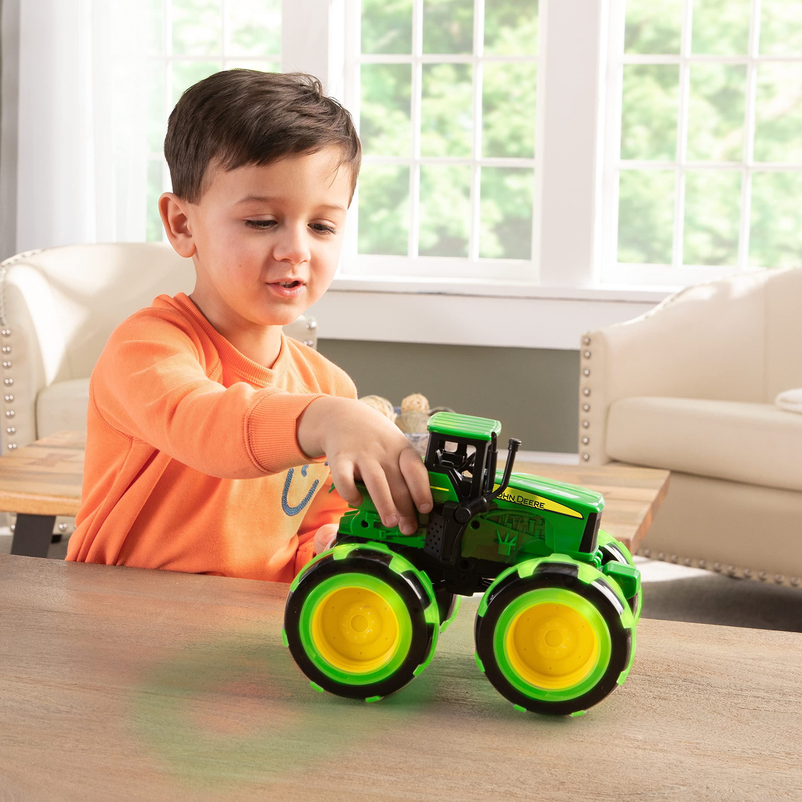 John Deere Tomy Monster Treads Lightning Wheels Tractor Toy - Motion Activated Light Up Monster Truck with Big Tires - Frustration Free Packaging - Best Gift for Boys & Girls Ages 3+ - Perfect for Indoor Play, Birthday Parties & Pretend Farming Adventures