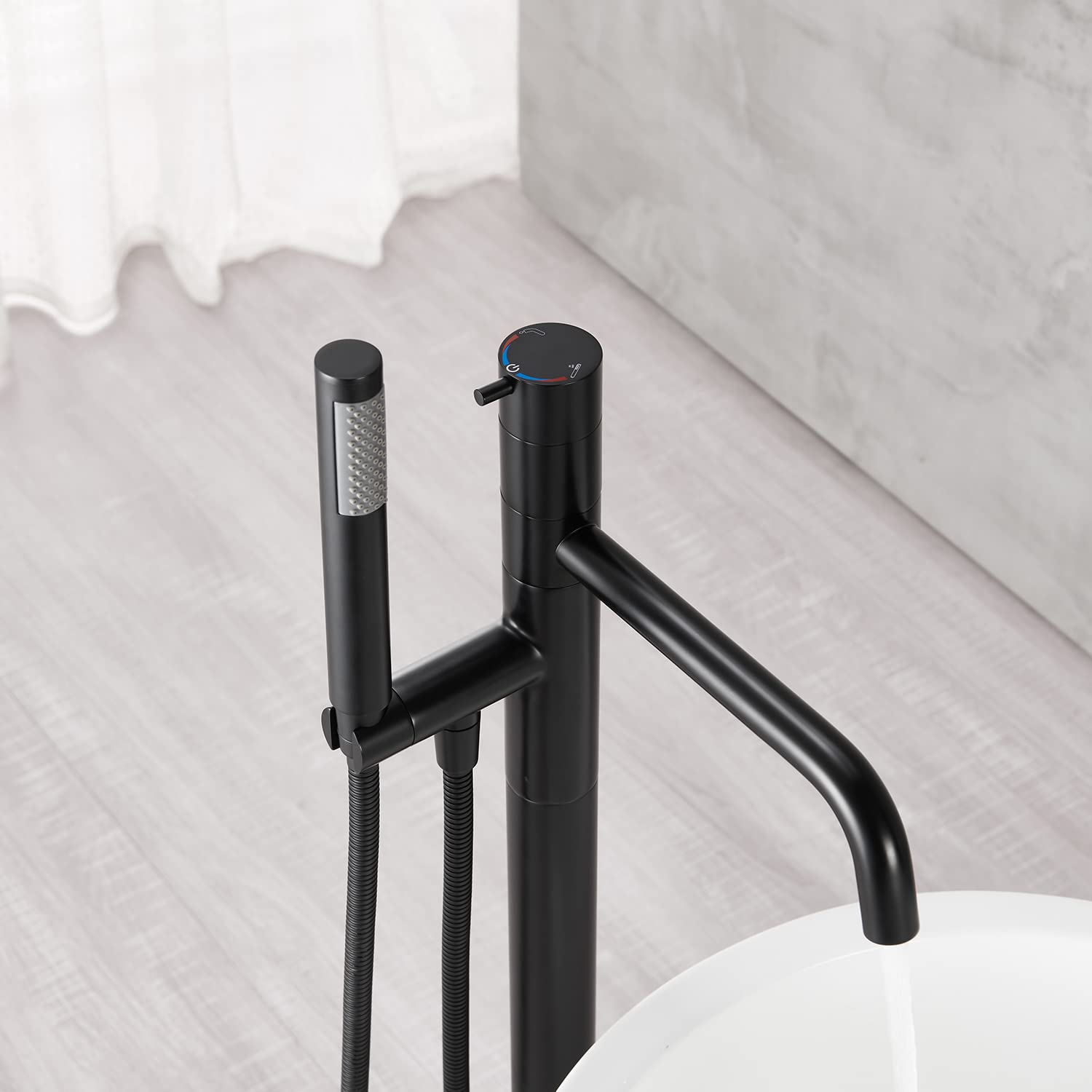 Freestanding Bathtub Faucet - Black Floor Mount Brass Single Handle Tub Filler with Hand Shower for Modern Bathroom | Perfect for Spa-Like Relaxation & Luxury Bathing Experience