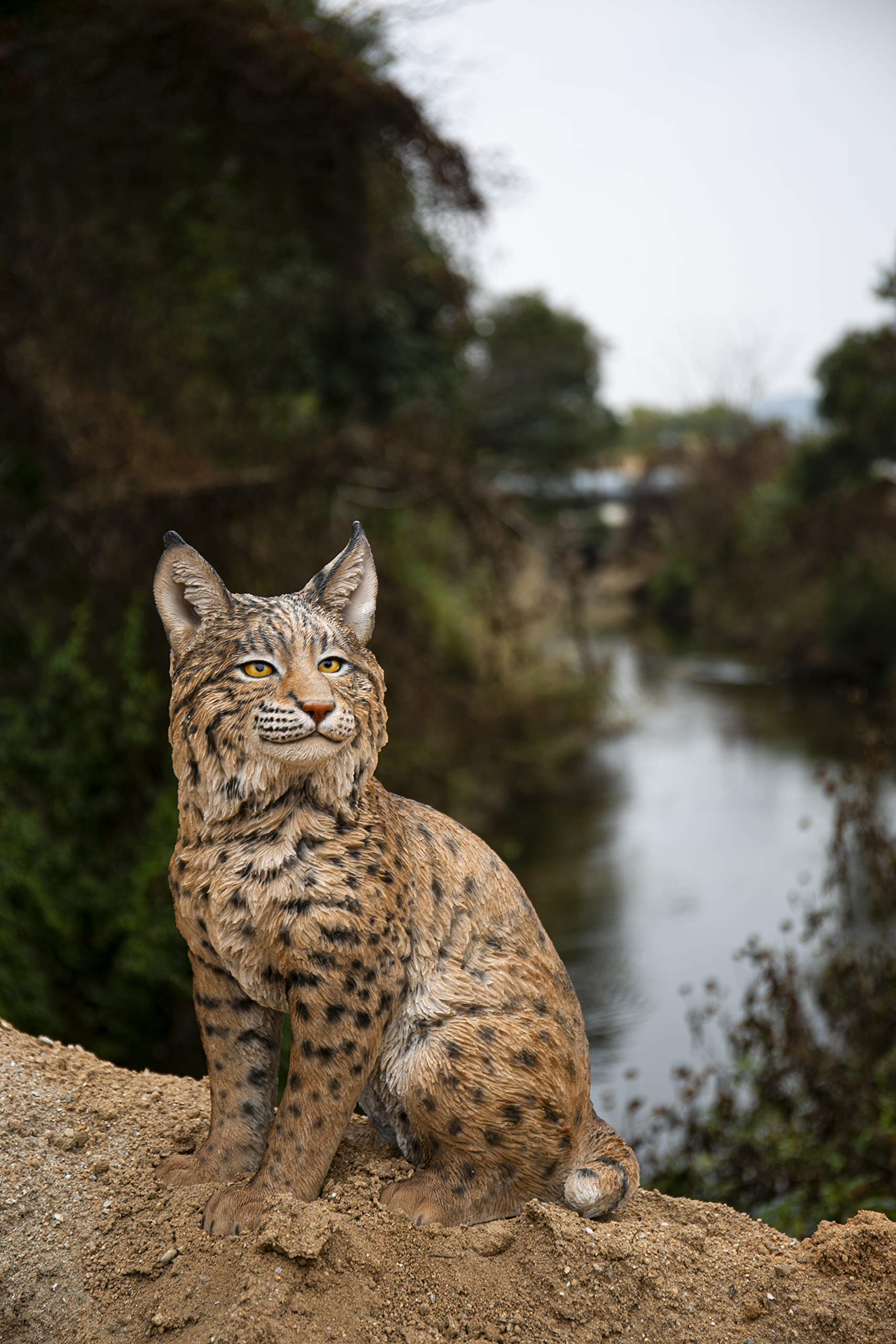 Hi-Line Gift Ltd. Sitting Bobcat Statue - Realistic Yellow and Black Decorative Figurine for Home, Office, or Garden Decor
