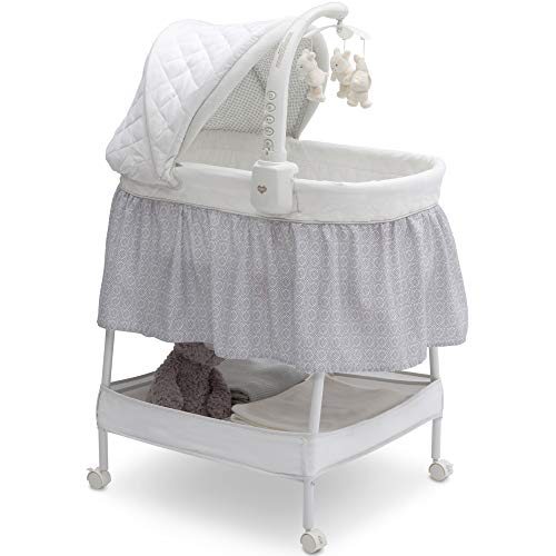 Delta Children Smooth Glide Bedside Bassinet - Portable Baby Crib with Removable Activity Mobile, Spinning Toys, Nightlight & Soothing Music | Silver Linings Design | Perfect for Newborns, Nursery & Co-Sleeping