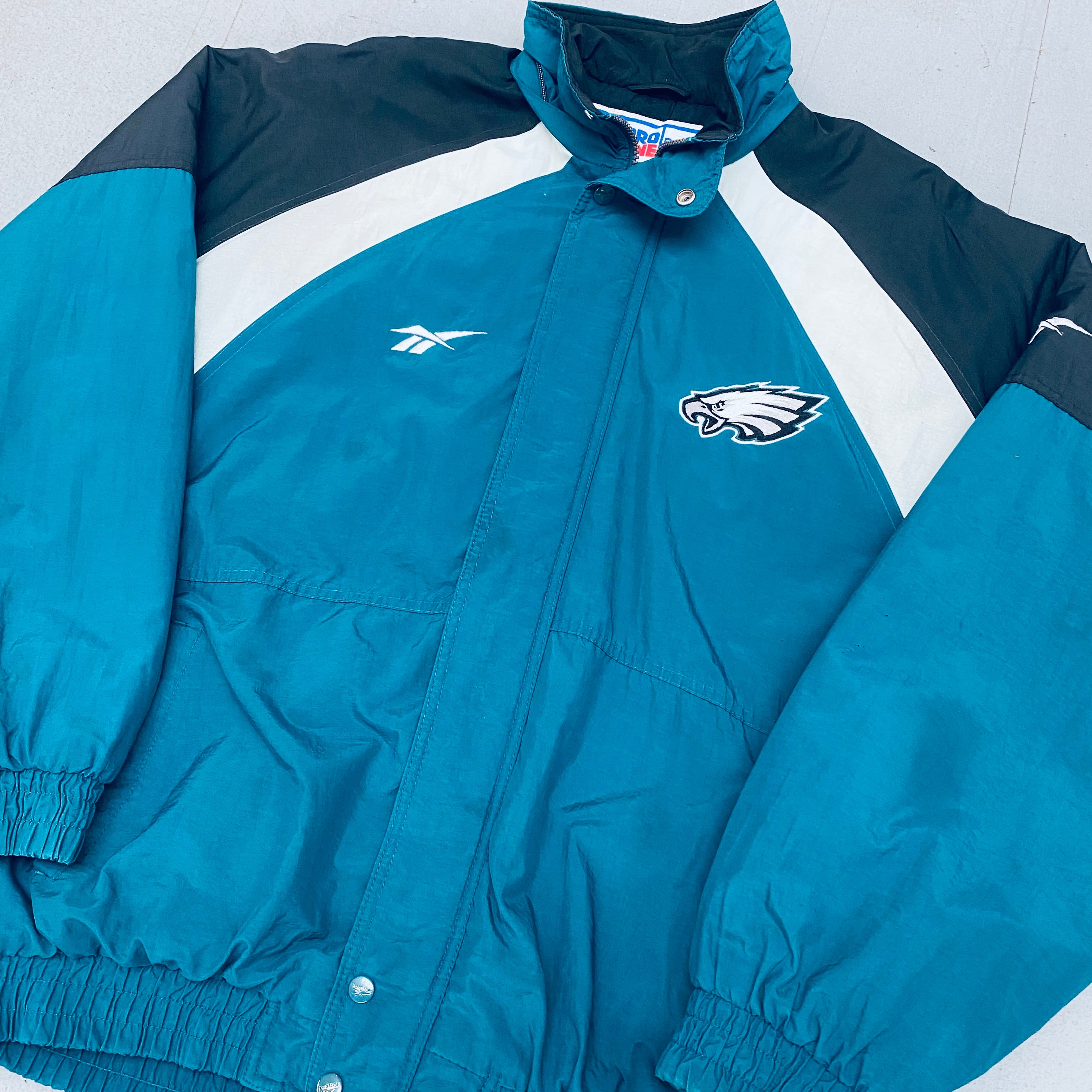 Philadelphia Eagles 1990s Reebok Reverse Spellout Full-Zip Proline Jacket for Men - Vintage NFL Football Fan Gear for Game Day & Casual Wear