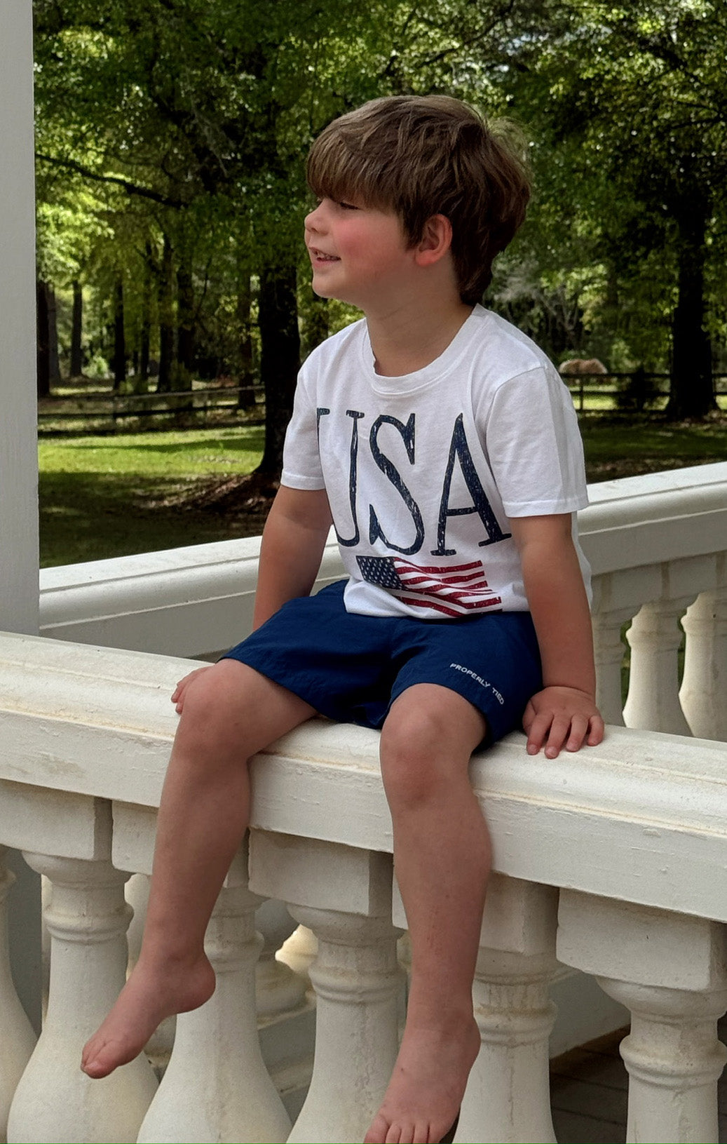 Little Travis Tee - Patriotic USA Flag Graphic T-Shirt for Men & Women | Casual Wear, Fourth of July Outfit, American Pride Apparel