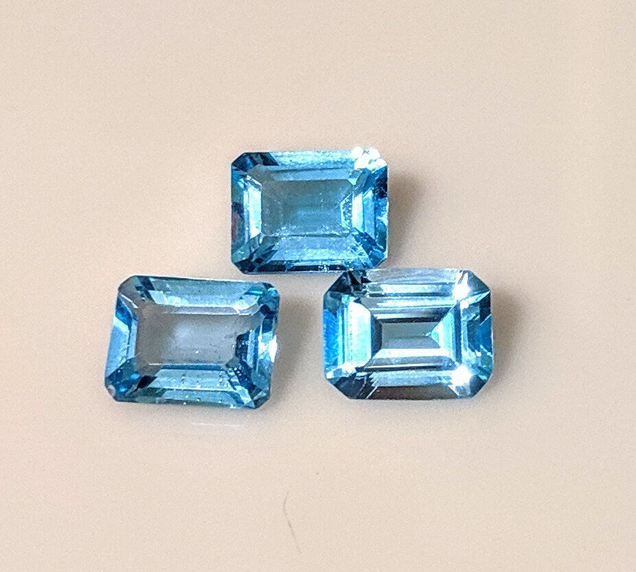 3-Piece Lot of Natural African Swiss Blue Topaz Loose Stones - 9x7mm Emerald Cut, 8.28ct Total Weight, VVS Eye Clean Quality for Jewelry Making, Engagement Rings & Custom Designs